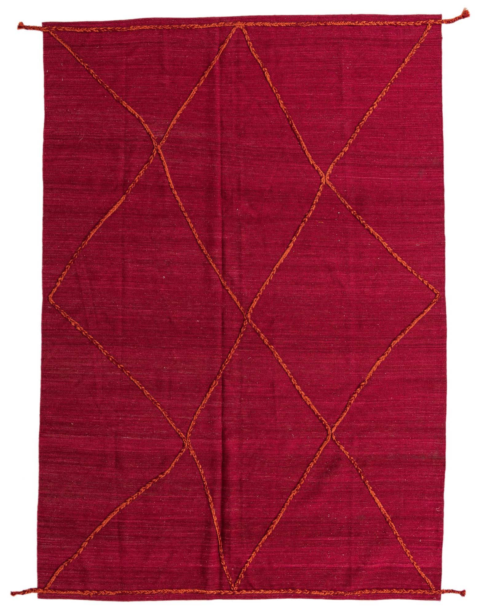 A 7x10 rectangular red shag rug with an orange tribal diamond pattern, ideal for a living room.