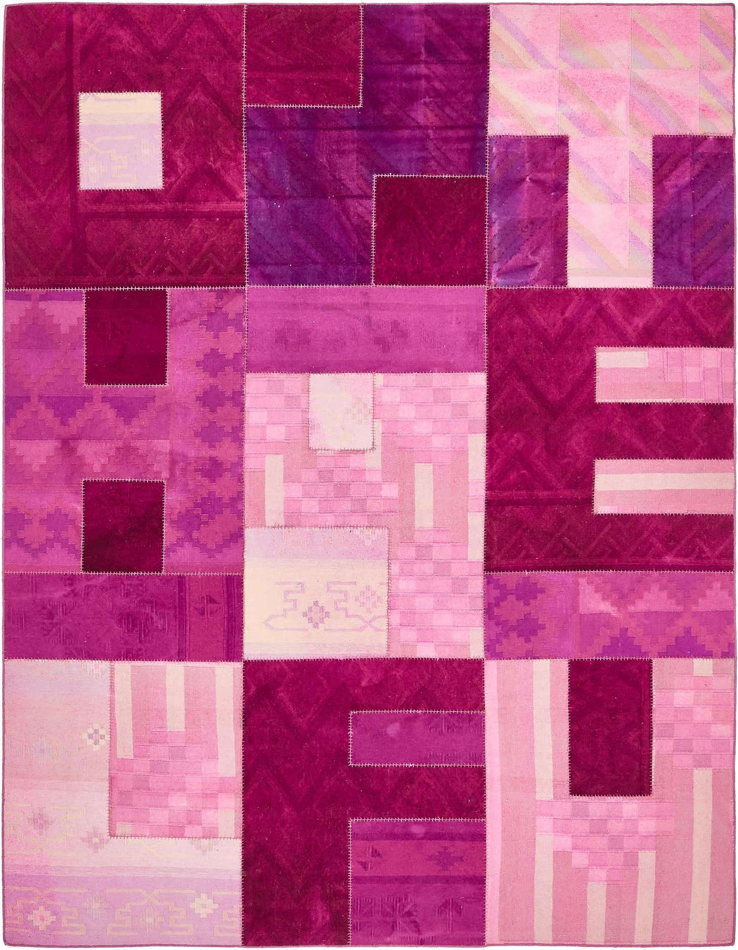 A 7x10 rectangular modern patchwork rug in various shades of red and pink, featuring abstract patterns and textures.