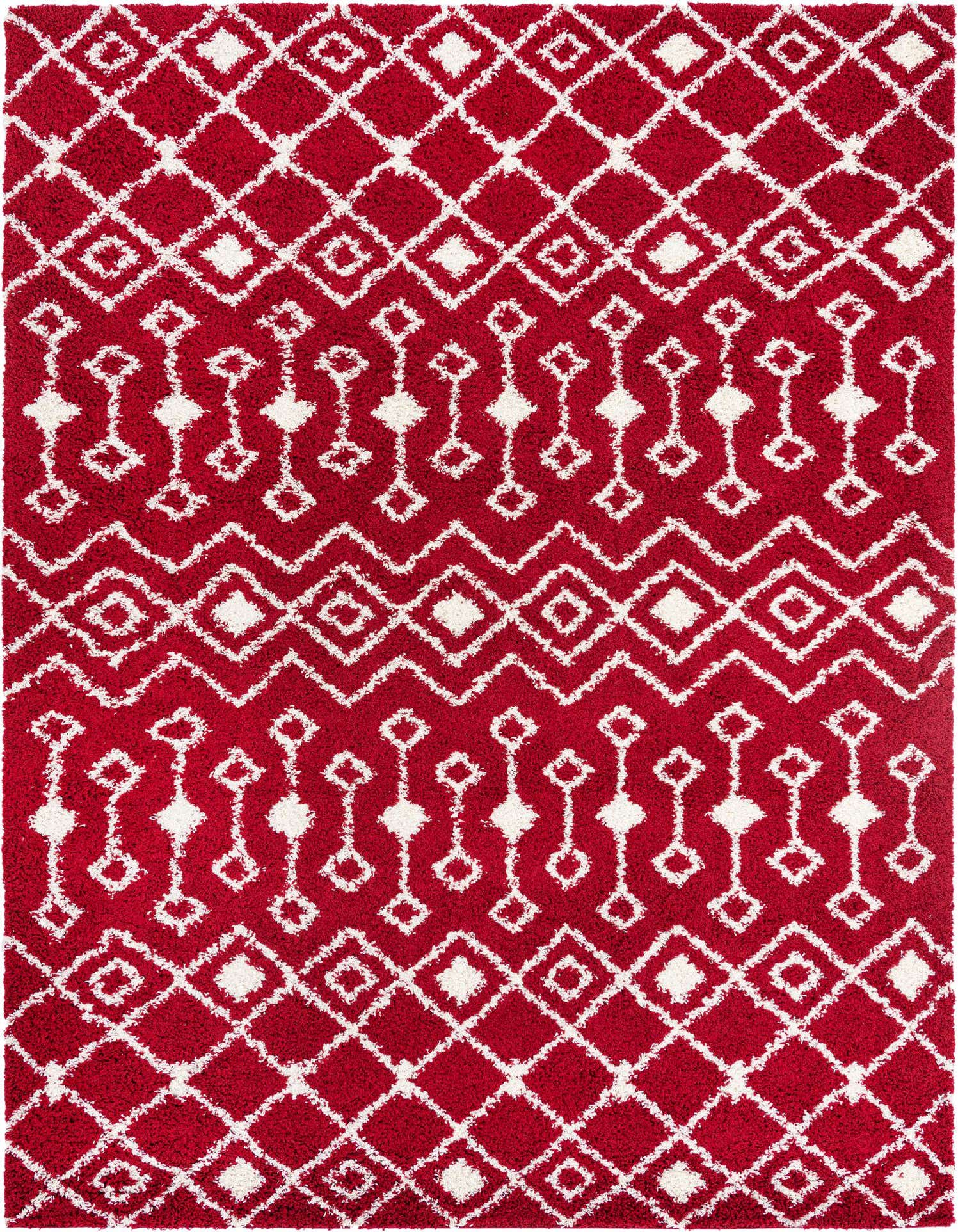 A 10x13 rectangular red shag rug with a white tribal geometric pattern, featuring diamonds and zigzags.
