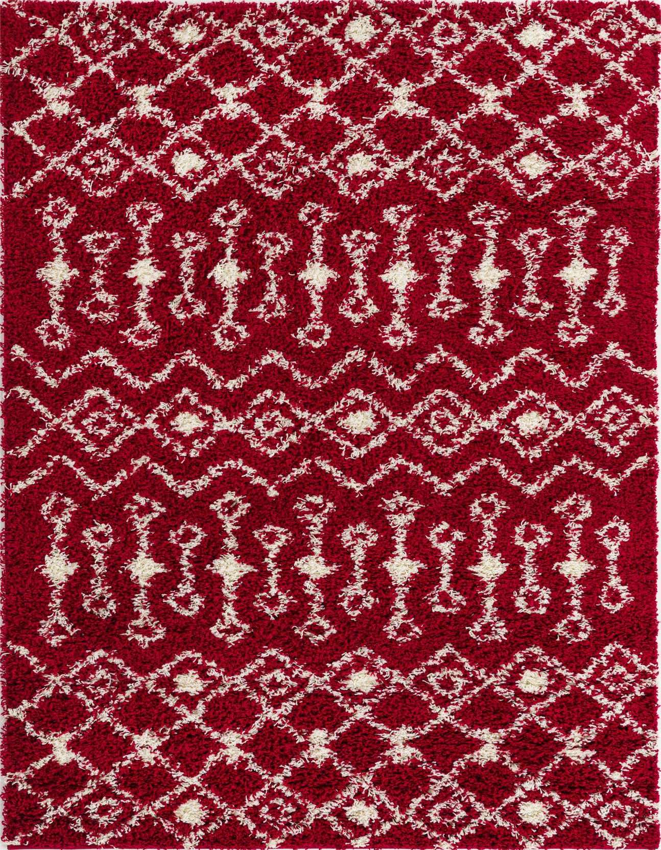 A 5x8 rectangular red shag rug with a white tribal and abstract pattern, perfect for a living room.