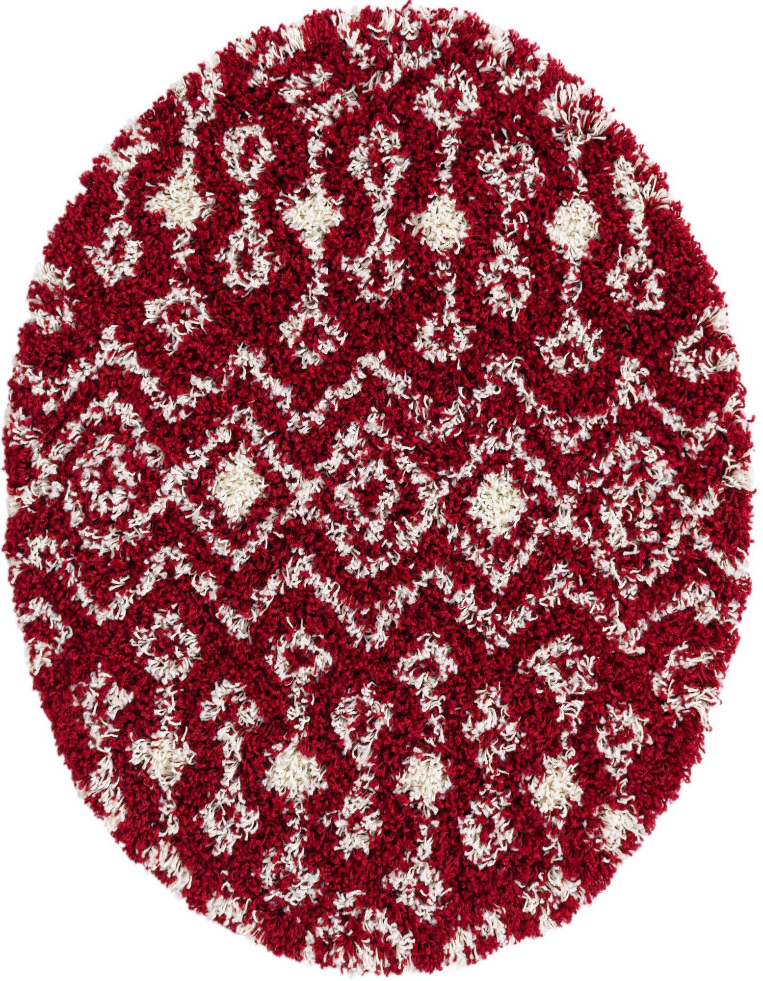 A 3' round red and off-white shag rug with a tribal, modern geometric pattern, perfect for a patio.