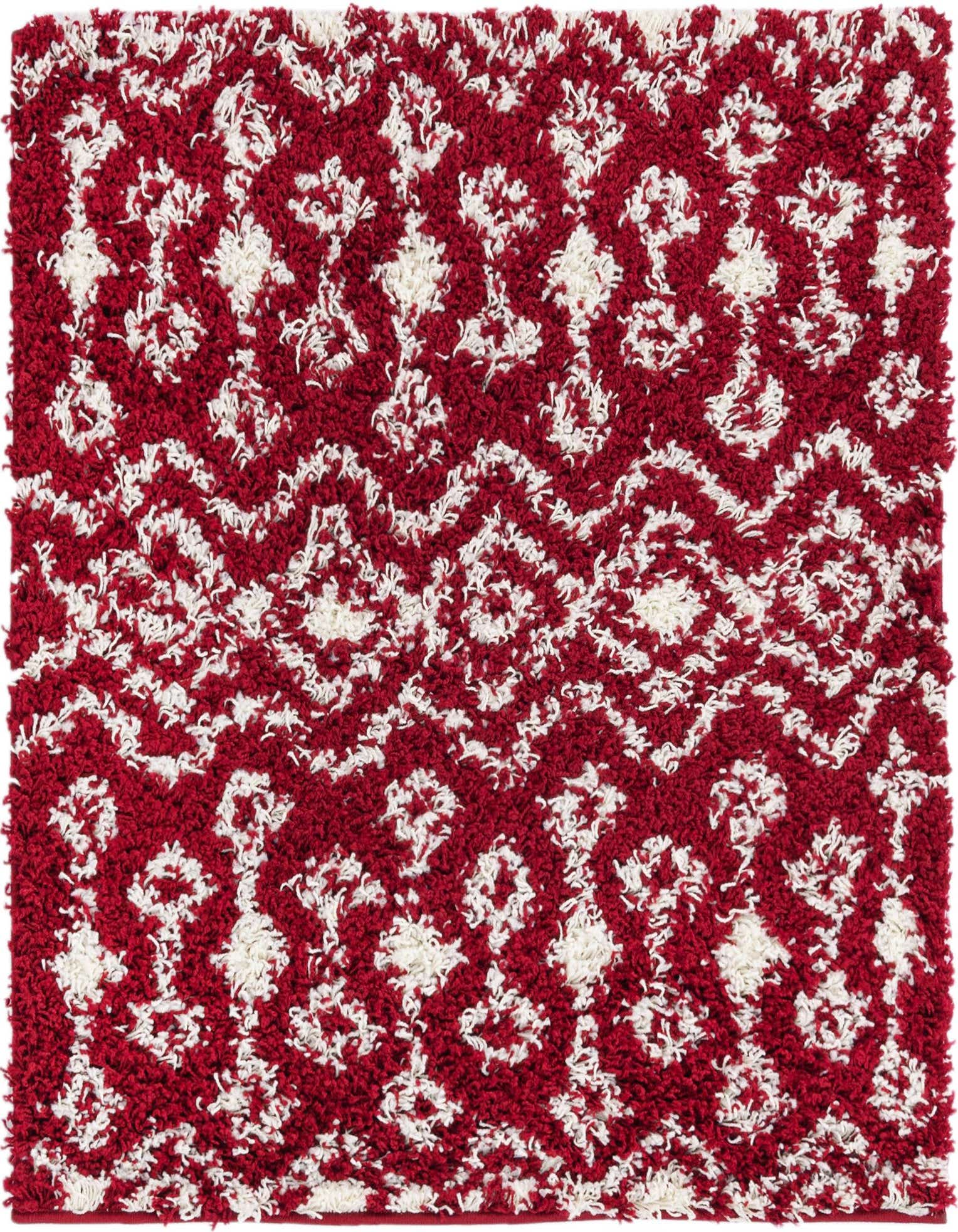 A 3'x3' square red and white shag rug with a modern tribal pattern, featuring textured pile.