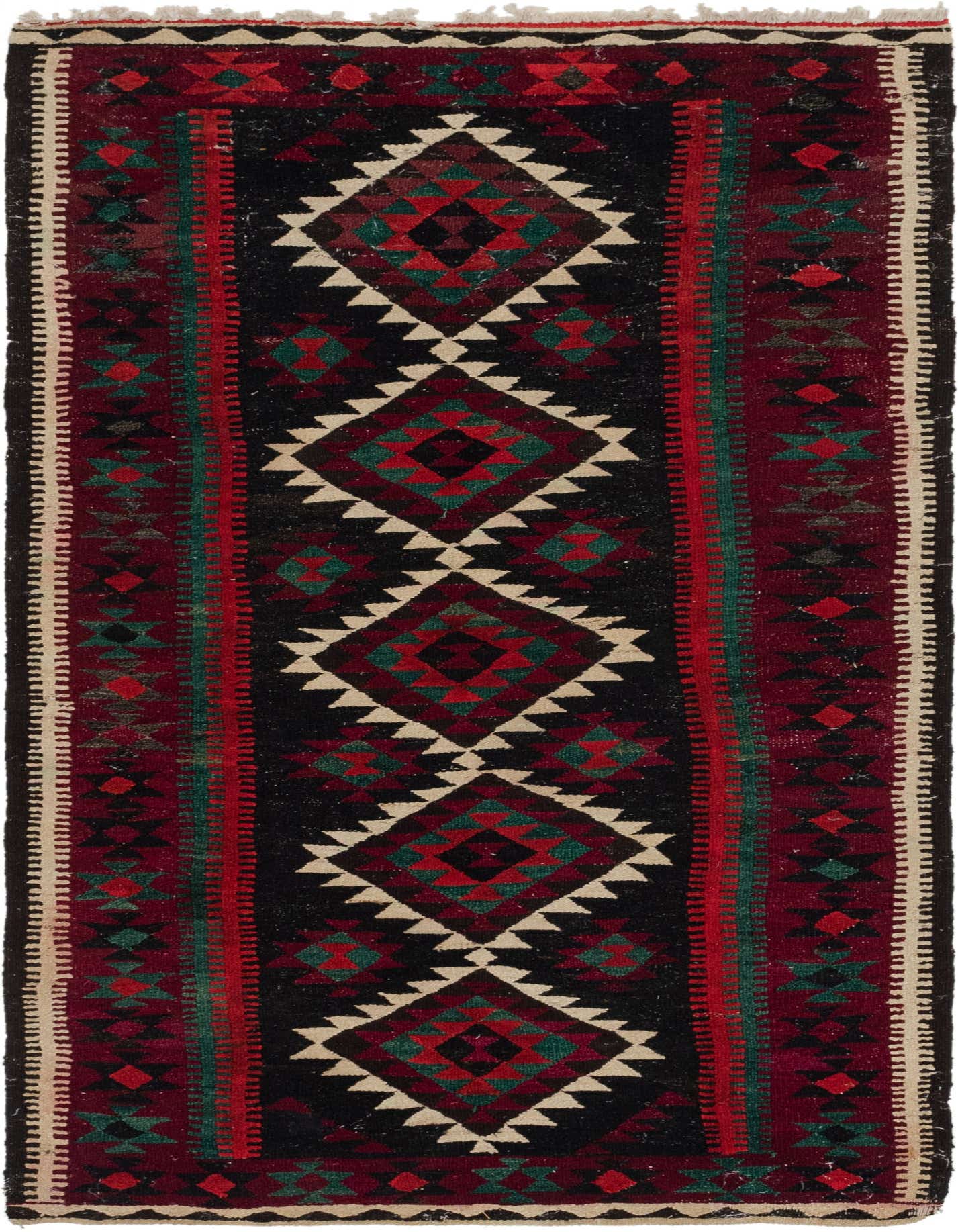 A 9 ft Kilim Fars runner rug with a black center, red and green geometric patterns, and cream accents.