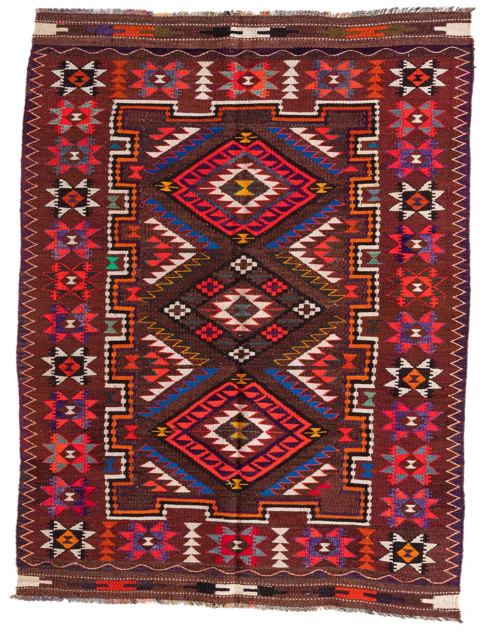 A 9 ft runner rug from the Kilim Fars collection, featuring a vibrant tribal pattern in reds, blues, and oranges on a dark brown background, suitable for a hallway.