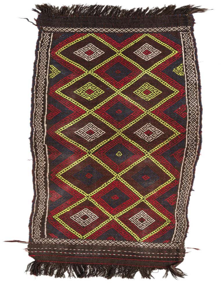 A 7 ft runner rug with a tribal Persian pattern in reds, black, and yellow, featuring diamond motifs and fringe.