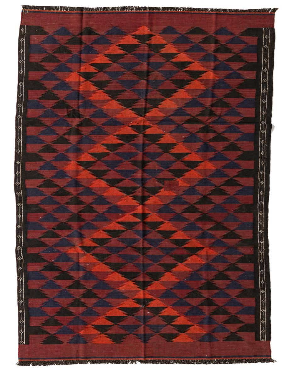 A handmade 11 ft Kilim Fars runner rug in red, black, and navy, featuring a tribal geometric pattern of interlocking triangles.
