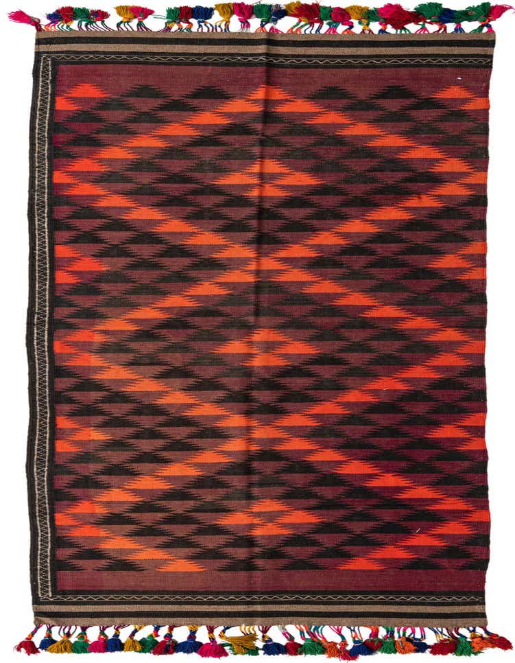 A 12 ft Kilim Fars runner rug with a tribal geometric pattern in shades of red, orange, and black, featuring colorful tassels.