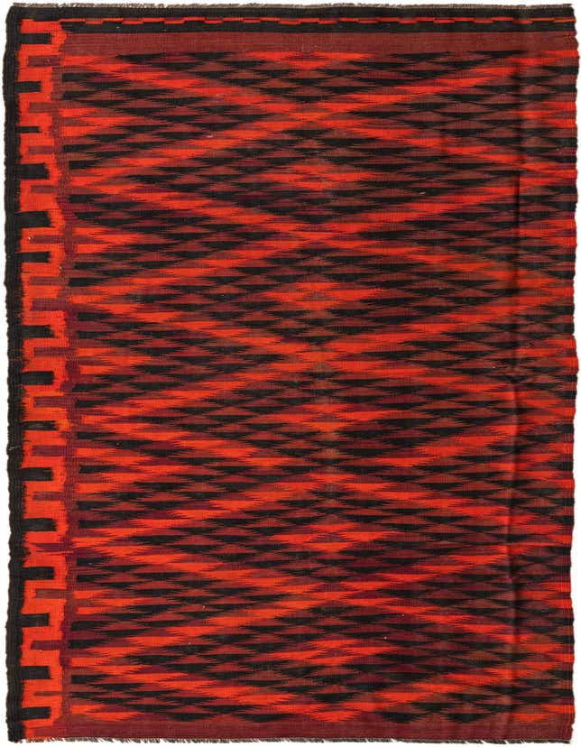 A 13 ft runner rug featuring a vibrant red and black tribal geometric pattern with a flatweave texture.