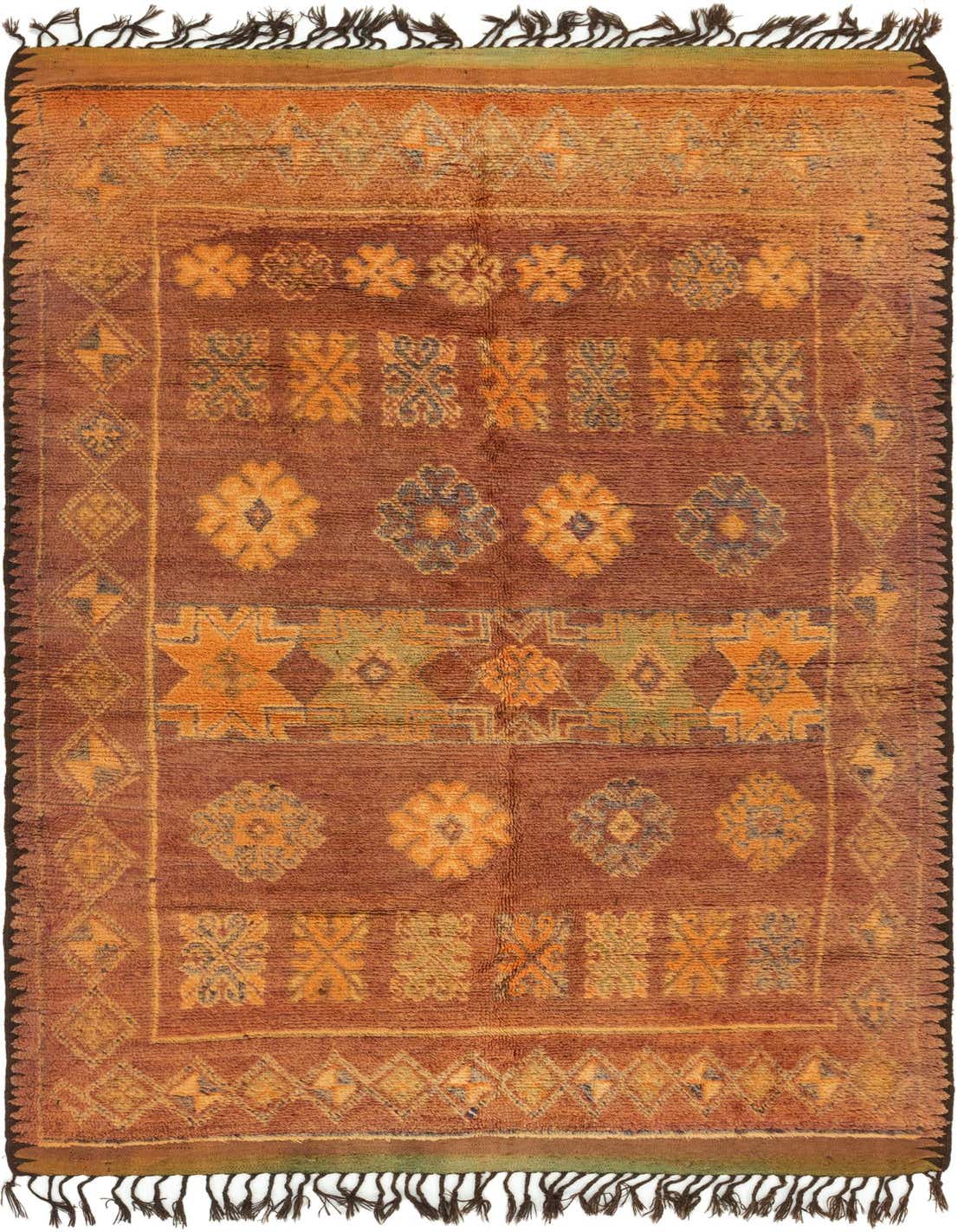 A handmade 11 ft runner rug in shades of red and orange with tribal and Southwestern patterns, featuring a shag pile and dark fringes.