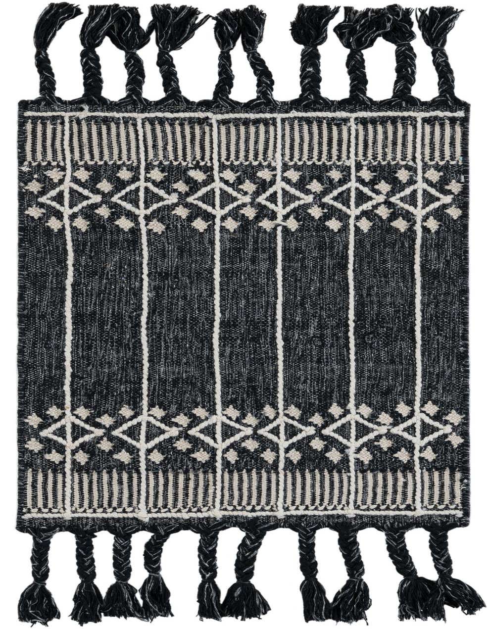 A 2x3 rectangular Eco Bohemian rug in black with white geometric patterns and braided tassels, suitable for indoor or outdoor use.