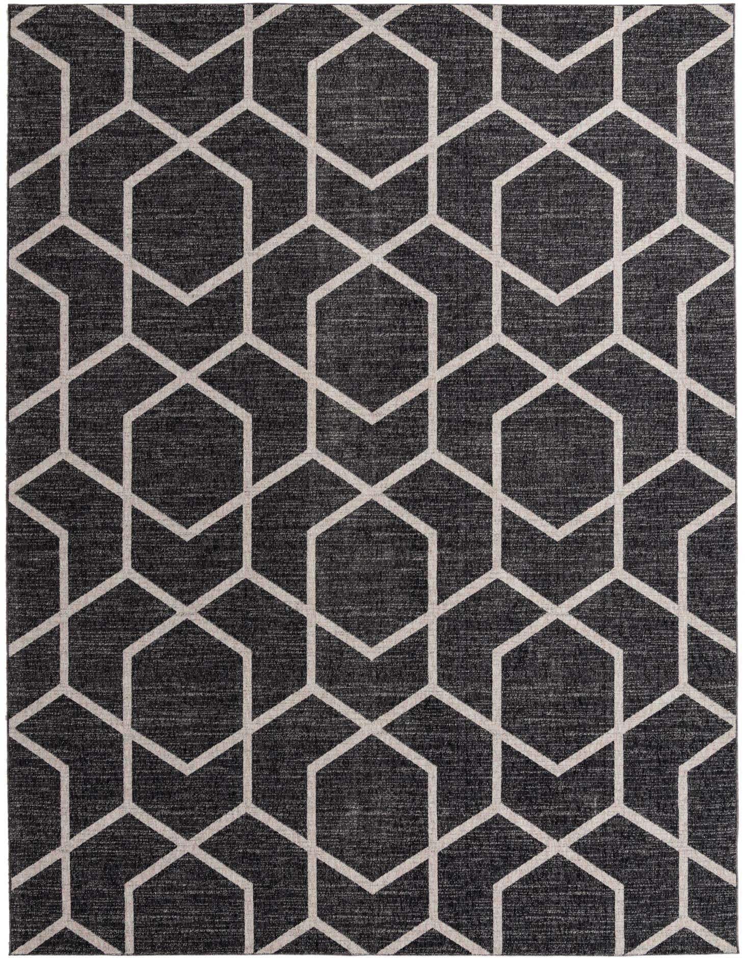 A 10x13 rectangular Eco Trellis rug featuring a modern geometric pattern of interlocking light gray hexagons on a dark charcoal background.