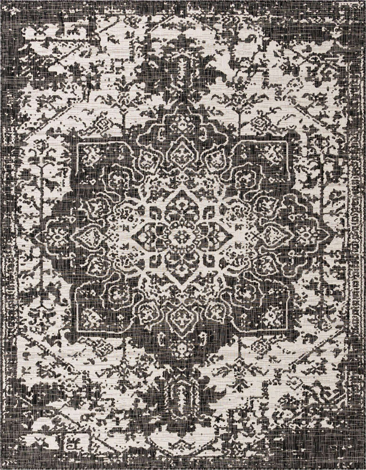 An 8x10 rectangular black and gray Mediterranean medallion rug with a distressed, textured pattern, suitable for indoor or outdoor use.