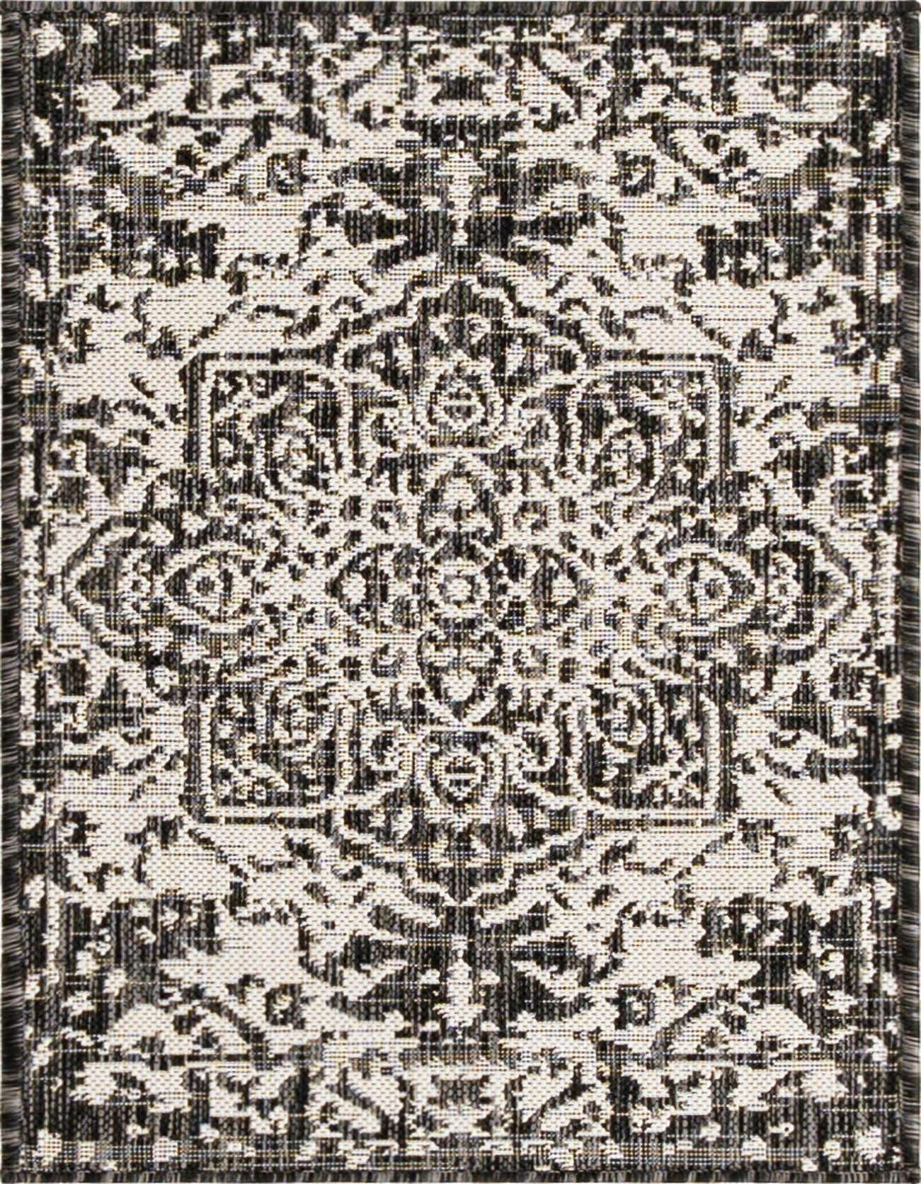 A 2x3 rectangular black and white Mediterranean-style outdoor rug with a central medallion pattern and textured flatweave.