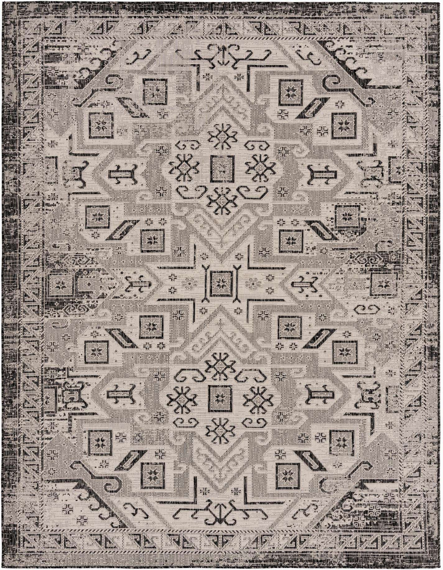 A 7x10 rectangular indoor/outdoor rug featuring a distressed black and gray Southwestern tribal pattern.