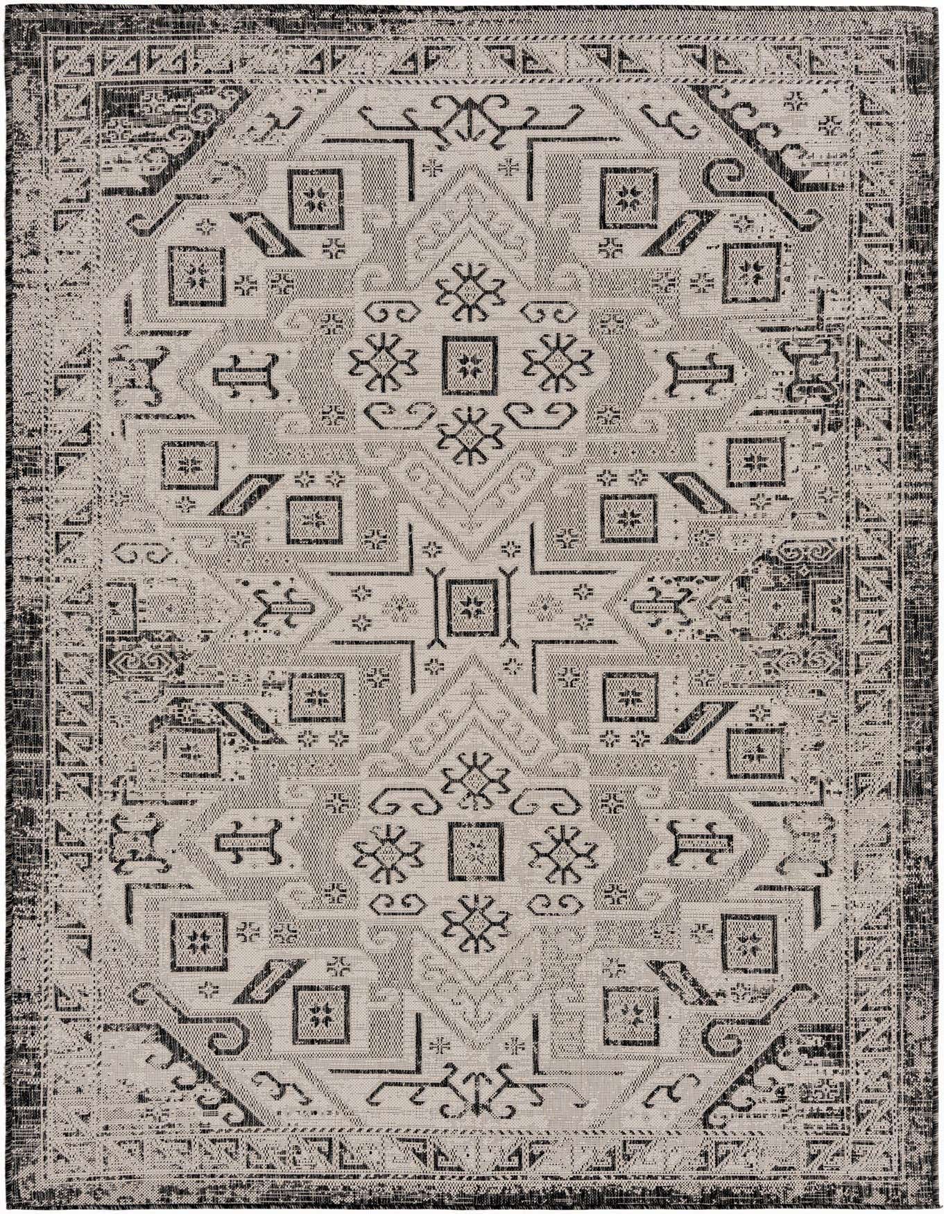 A 6x9 rectangular Rugs.com Outdoor Aztec rug featuring a distressed black and gray Southwestern tribal pattern.
