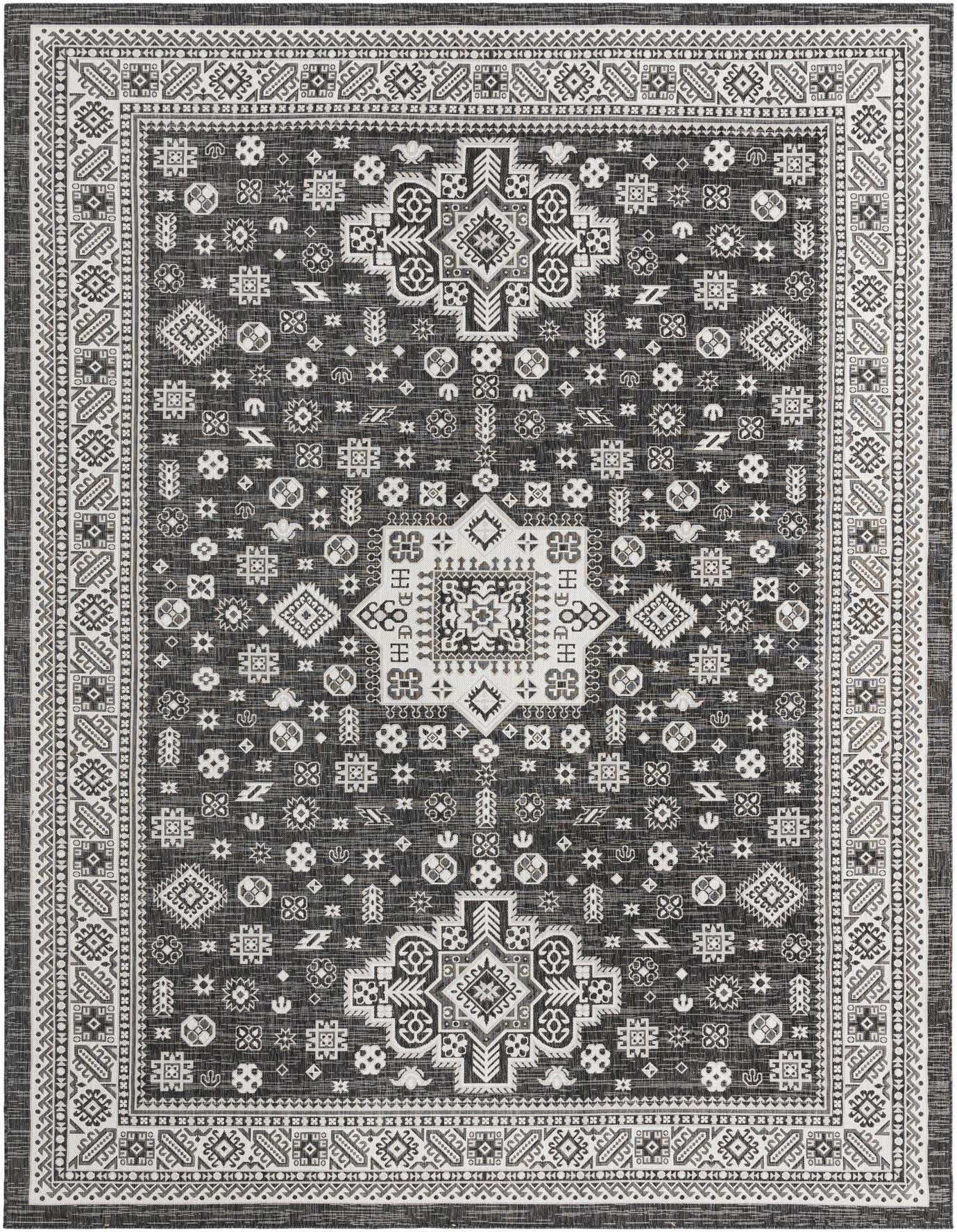 A 10x14 rectangular black and white Southwestern rug with a detailed tribal pattern and border.