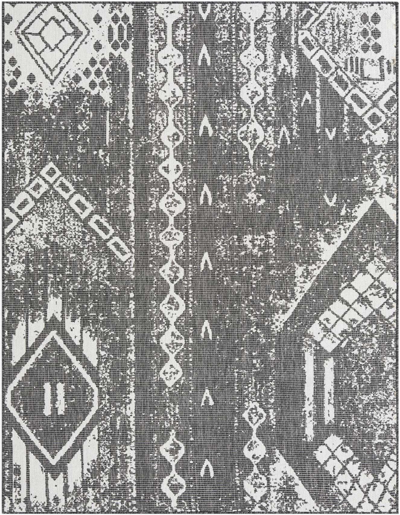 A 6x9 rectangular black and white modern rug with a distressed geometric pattern, suitable for indoor or outdoor use.