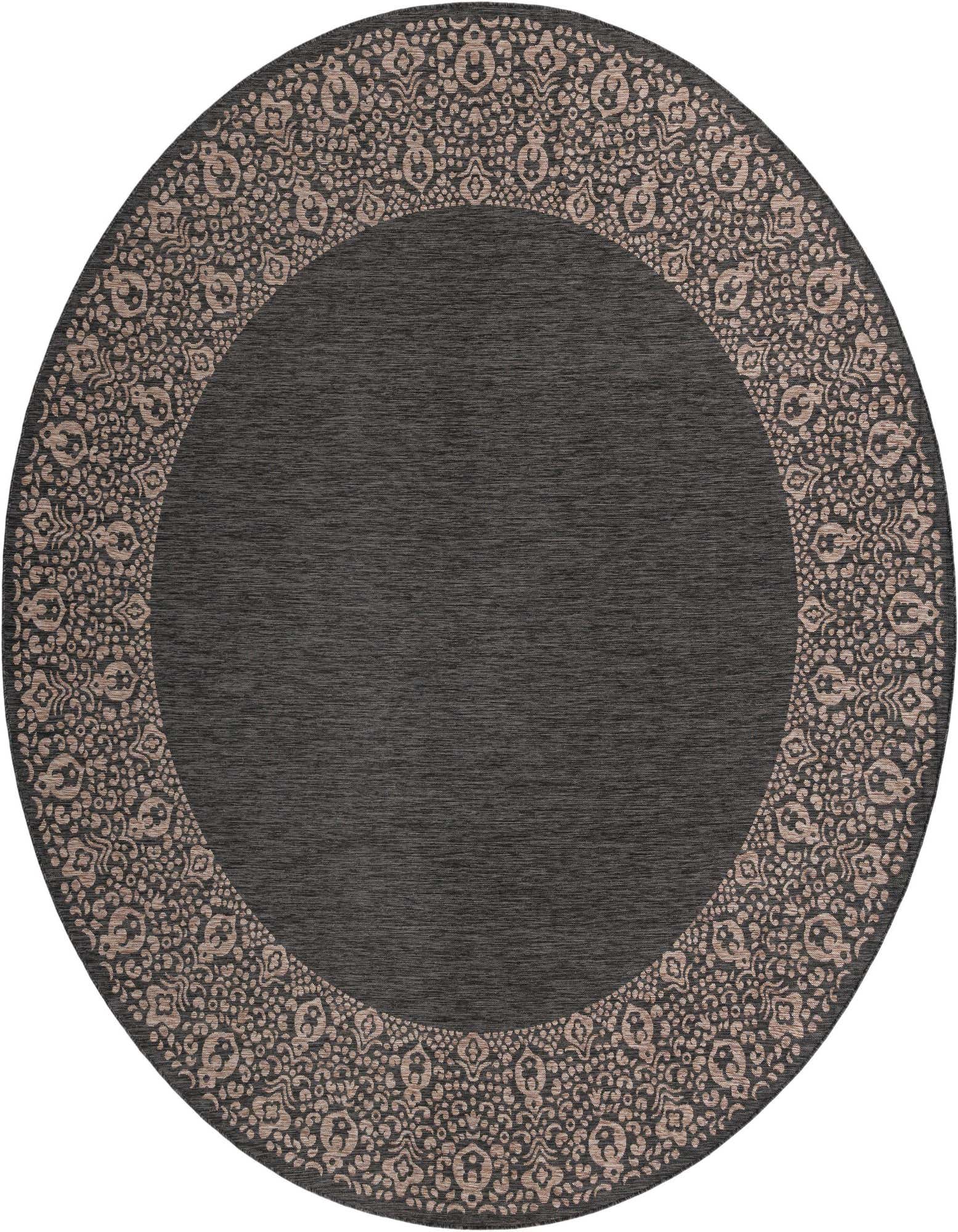 A large round black and gray outdoor rug with a light beige vintage border pattern, suitable for a patio.