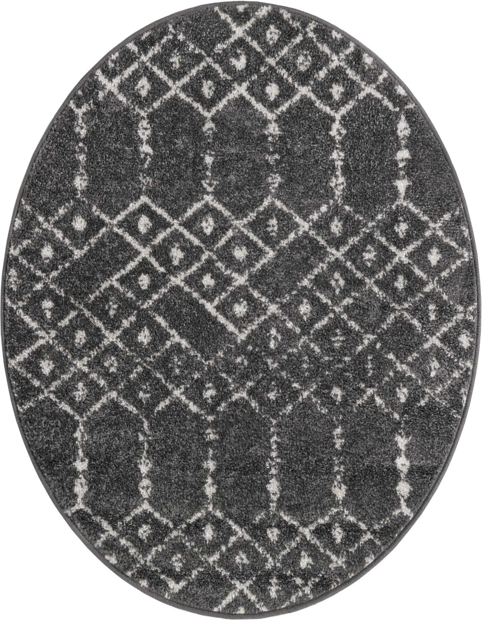 A round, dark gray Paxon Trellis rug with a white tribal geometric pattern, perfect for a modern living space.