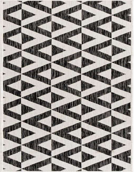 A black and white 8 ft runner rug with a modern geometric trellis pattern, suitable for hallways or patios.