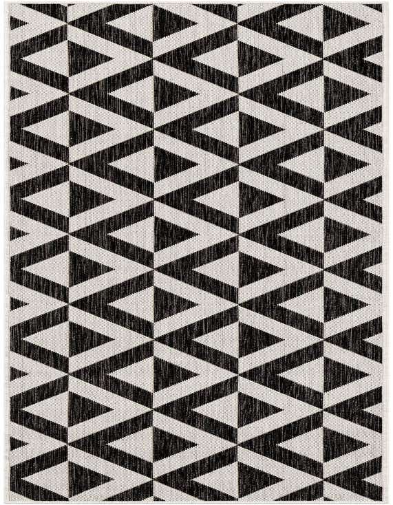 A 7 ft runner rug featuring a bold black and white geometric trellis pattern, suitable for a hallway or patio.