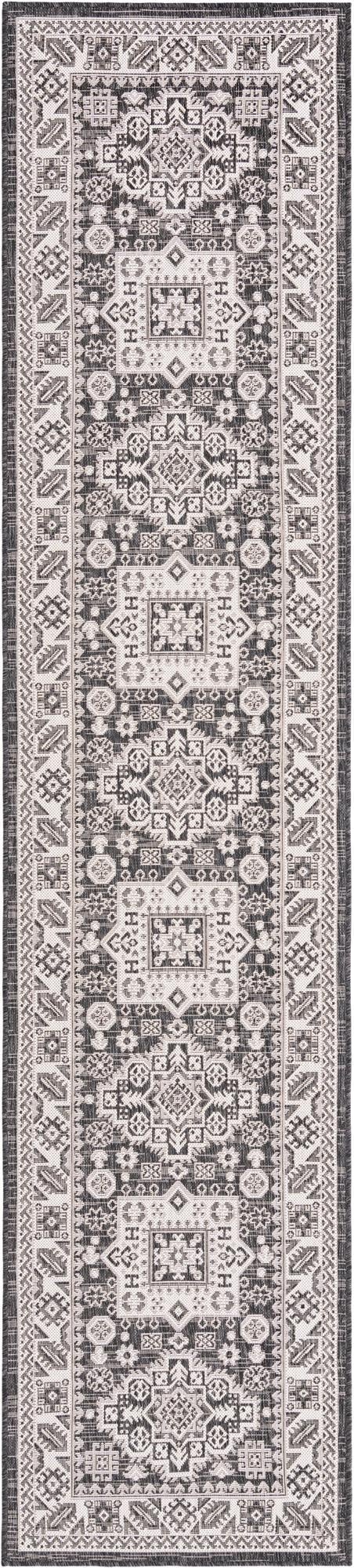A 12 ft runner rug in black and white with a Southwestern tribal pattern, suitable for hallways or patios.