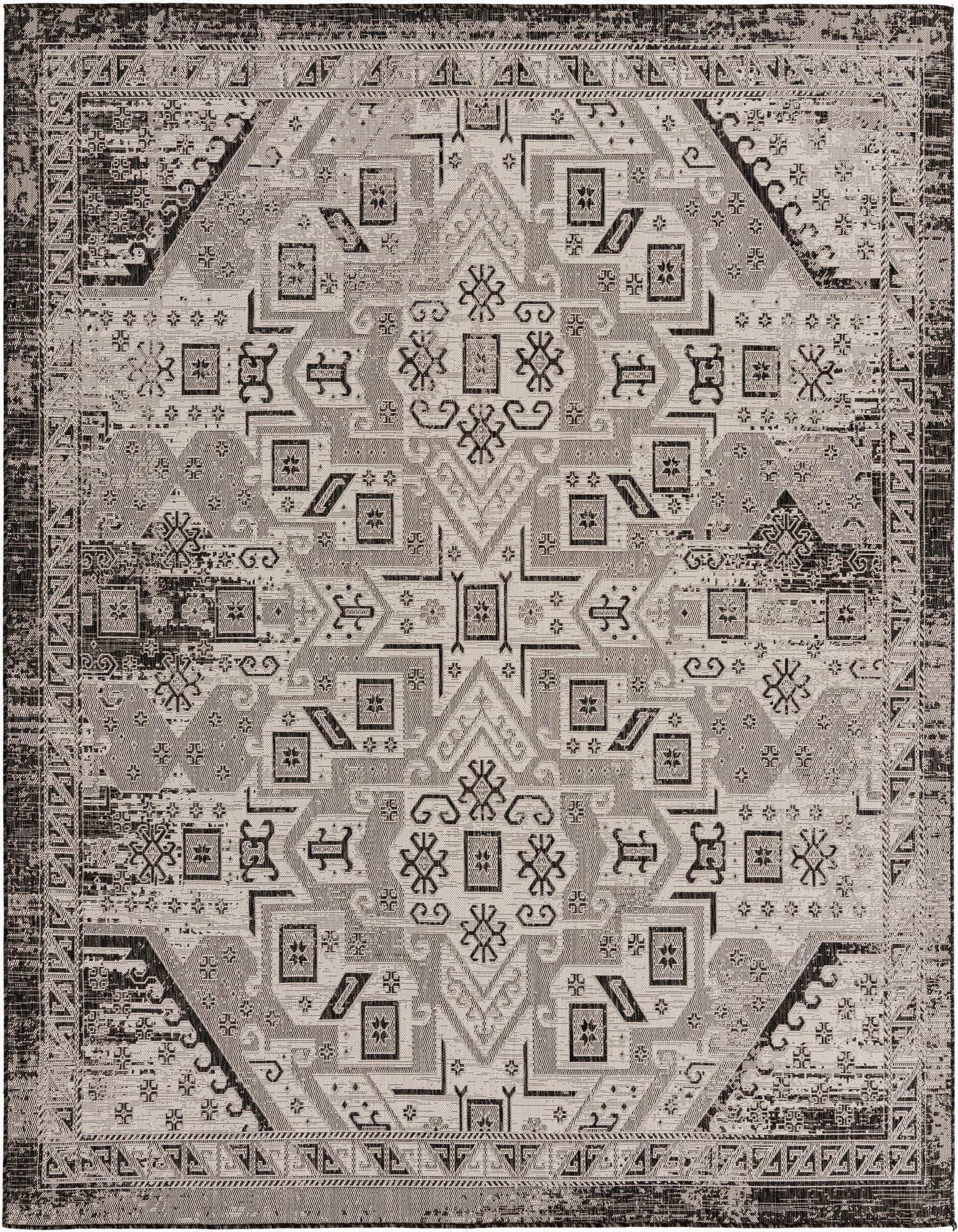 A 10'x10' square Rugs.com Outdoor Aztec rug featuring a distressed black and gray Southwestern tribal pattern.