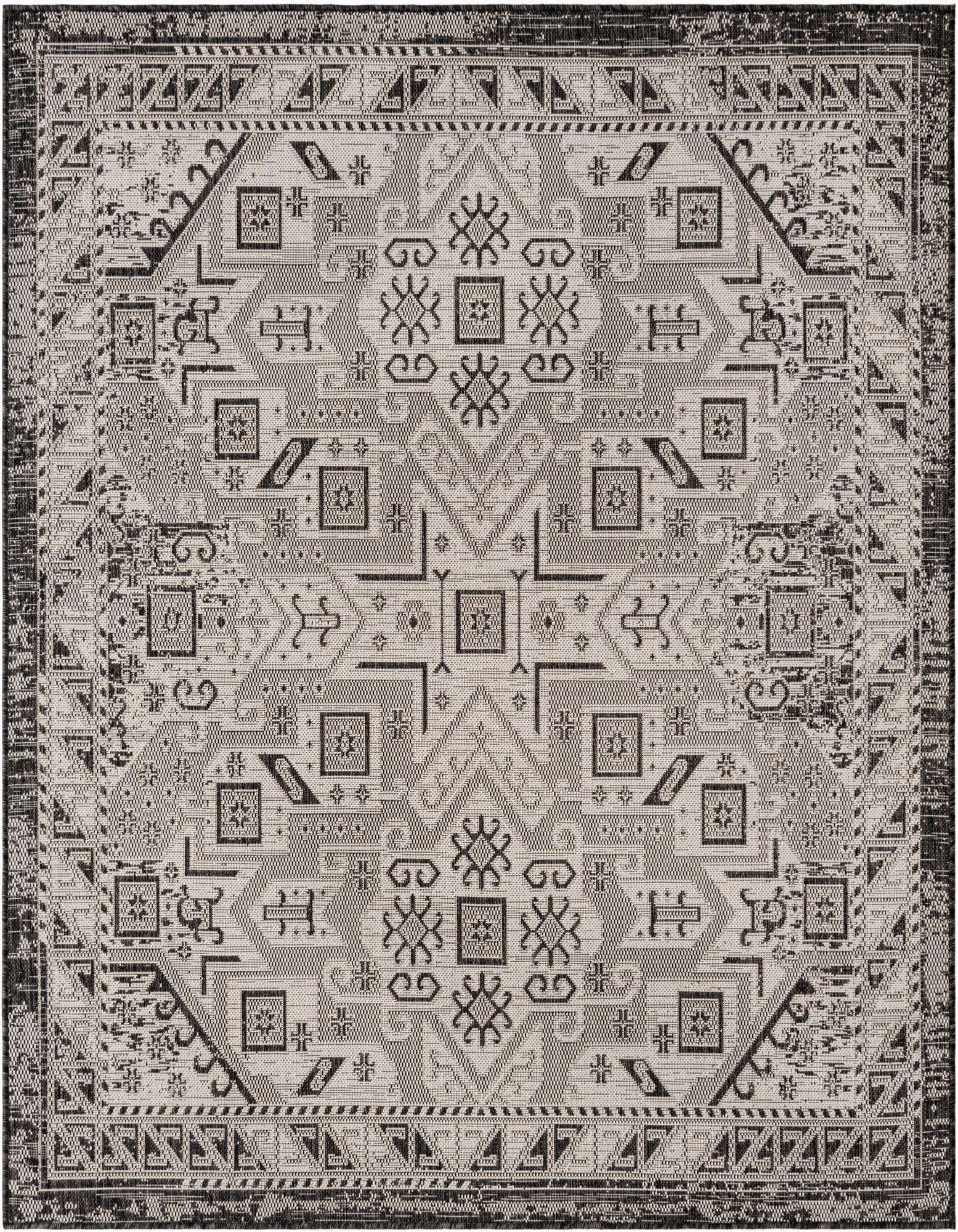 A 6'x6' square black and gray Southwestern flatweave rug with a tribal geometric pattern, suitable for indoor or outdoor use.