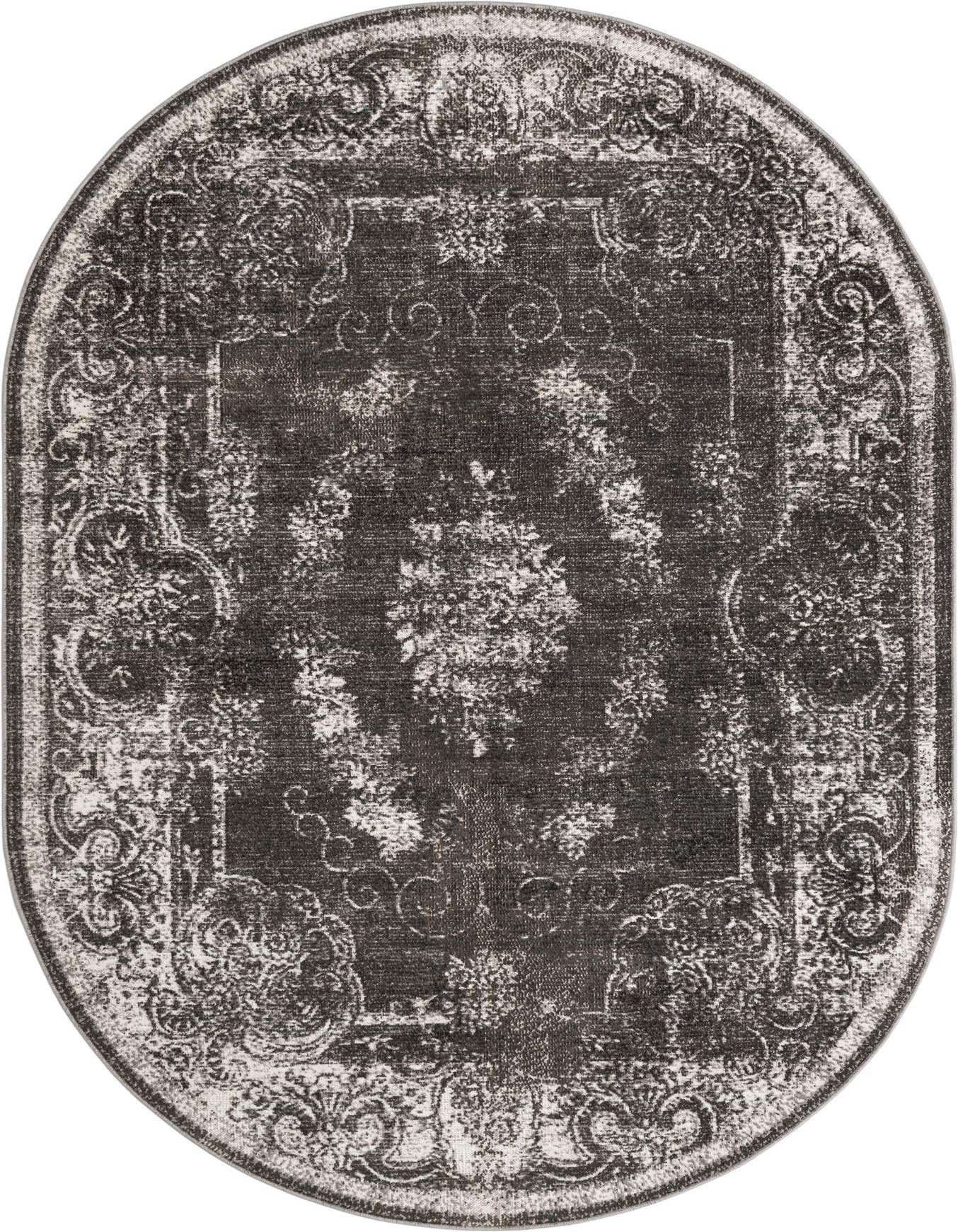 An oval 6' 1 x 9' 0 black and gray area rug with a distressed traditional pattern, ideal for a living room or patio.