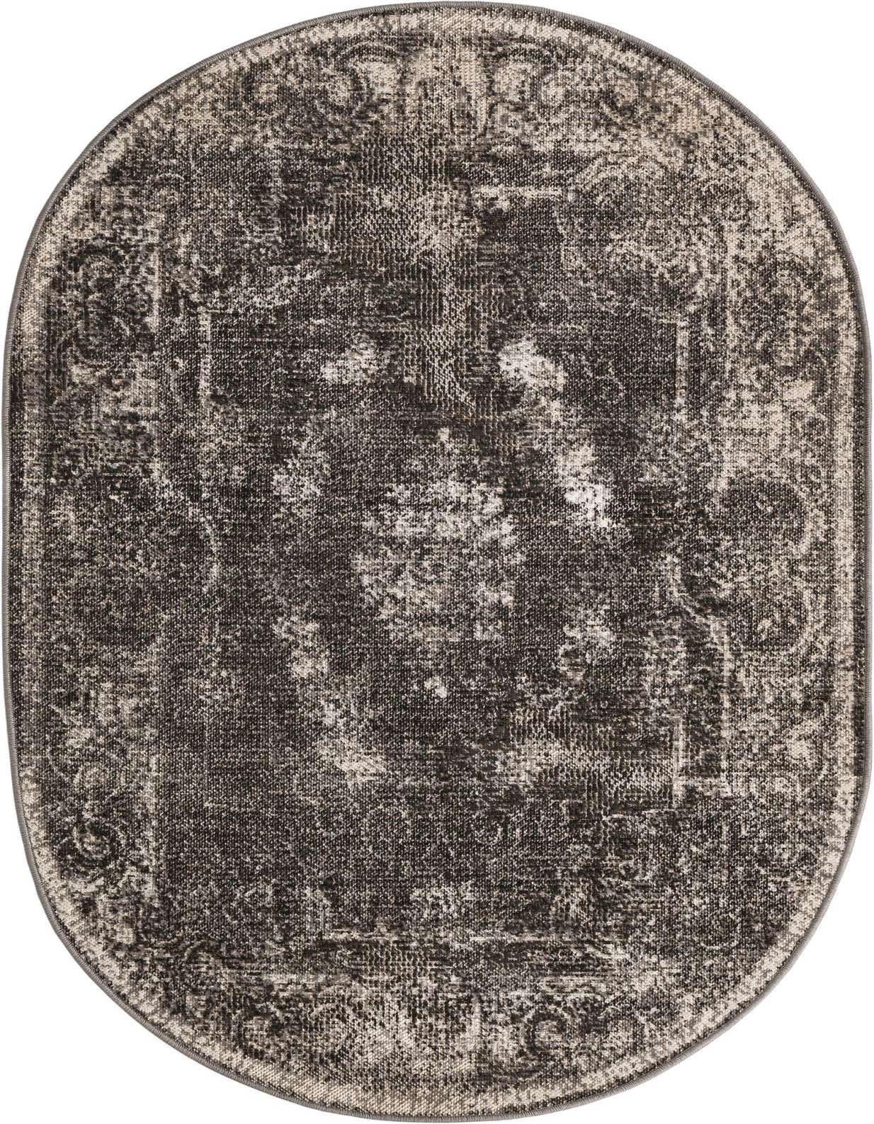 A 3' 3 x 5' 3 oval Aarhus rug from Rugs.com, featuring a distressed black and gray pattern.