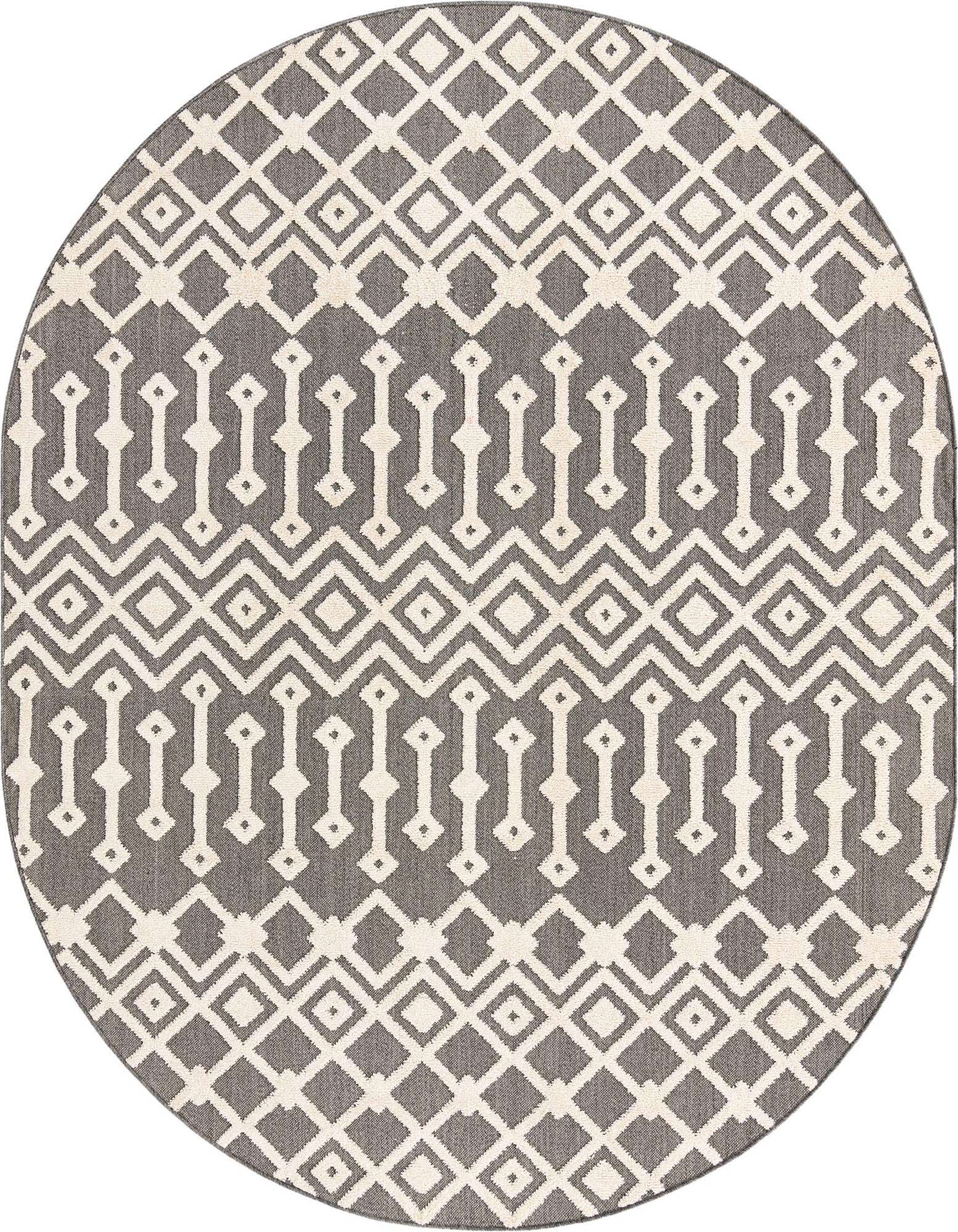 An oval Arlo rug featuring a modern tribal pattern in black and off-white, with a textured high/low pile.
