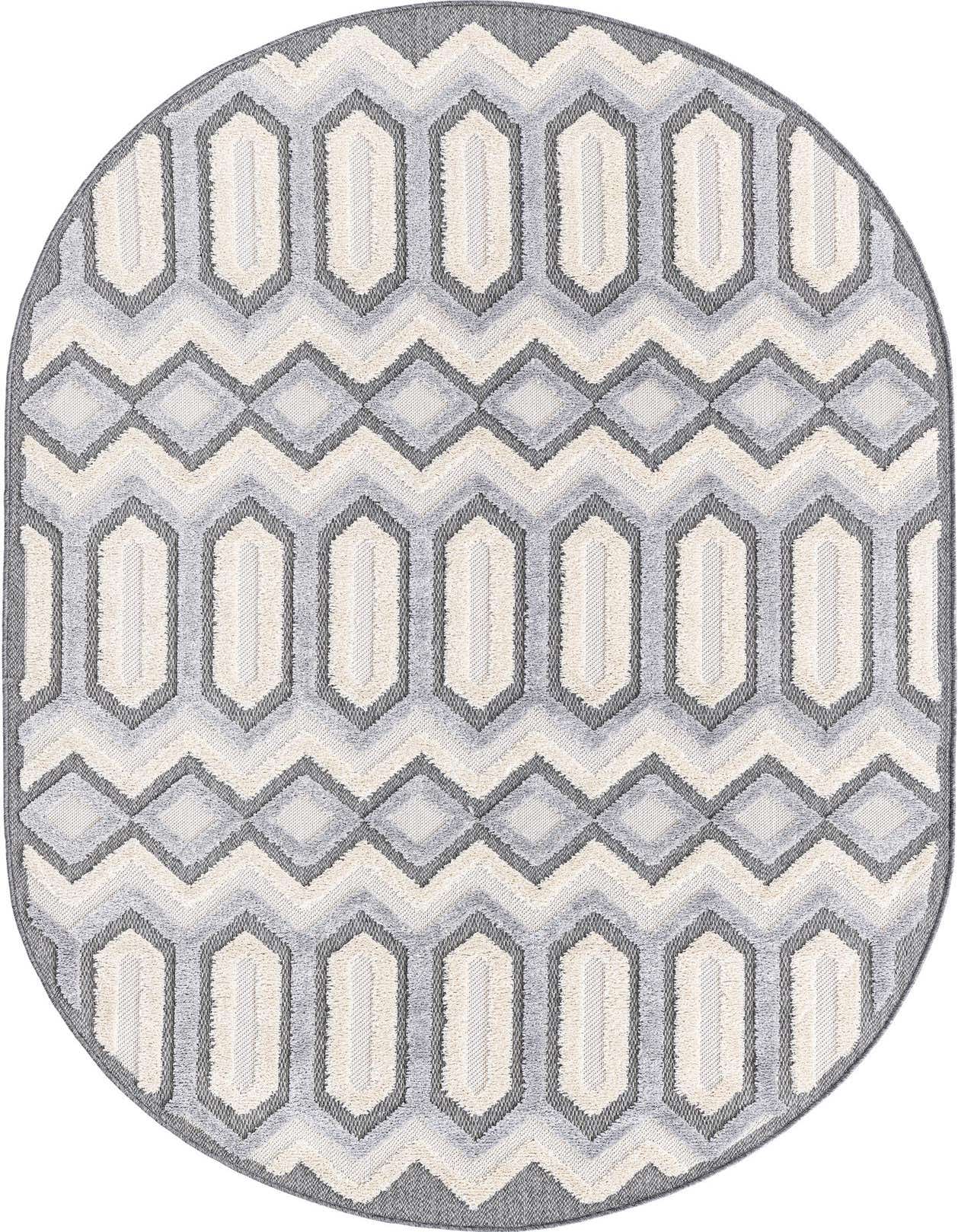Oval Arlo rug in black, gray, and silver with a modern tribal geometric pattern, featuring textured high/low pile.