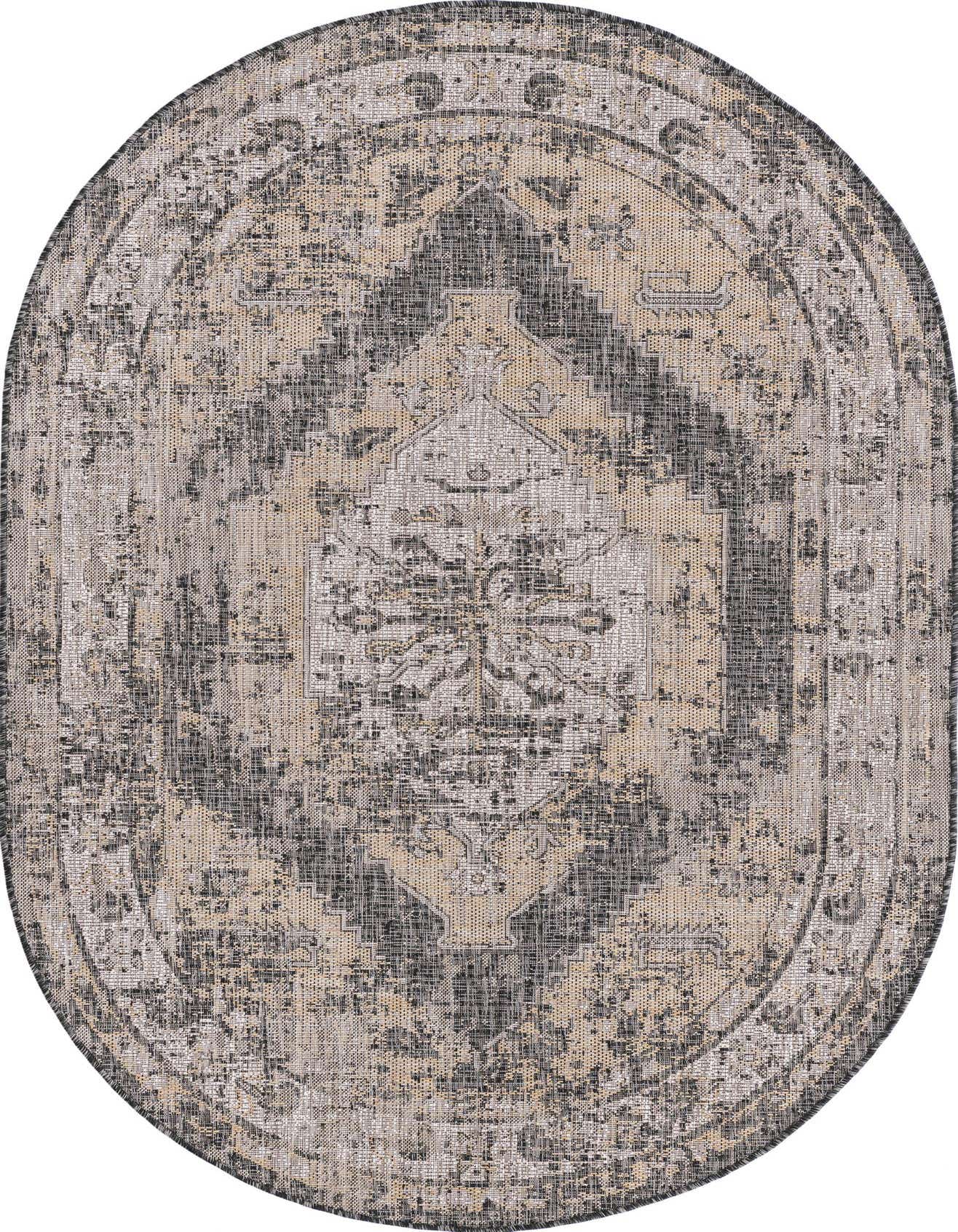 An oval 5'3" x 8'0" black and gray Southwestern style rug with a distressed traditional pattern, suitable for indoor or outdoor use.