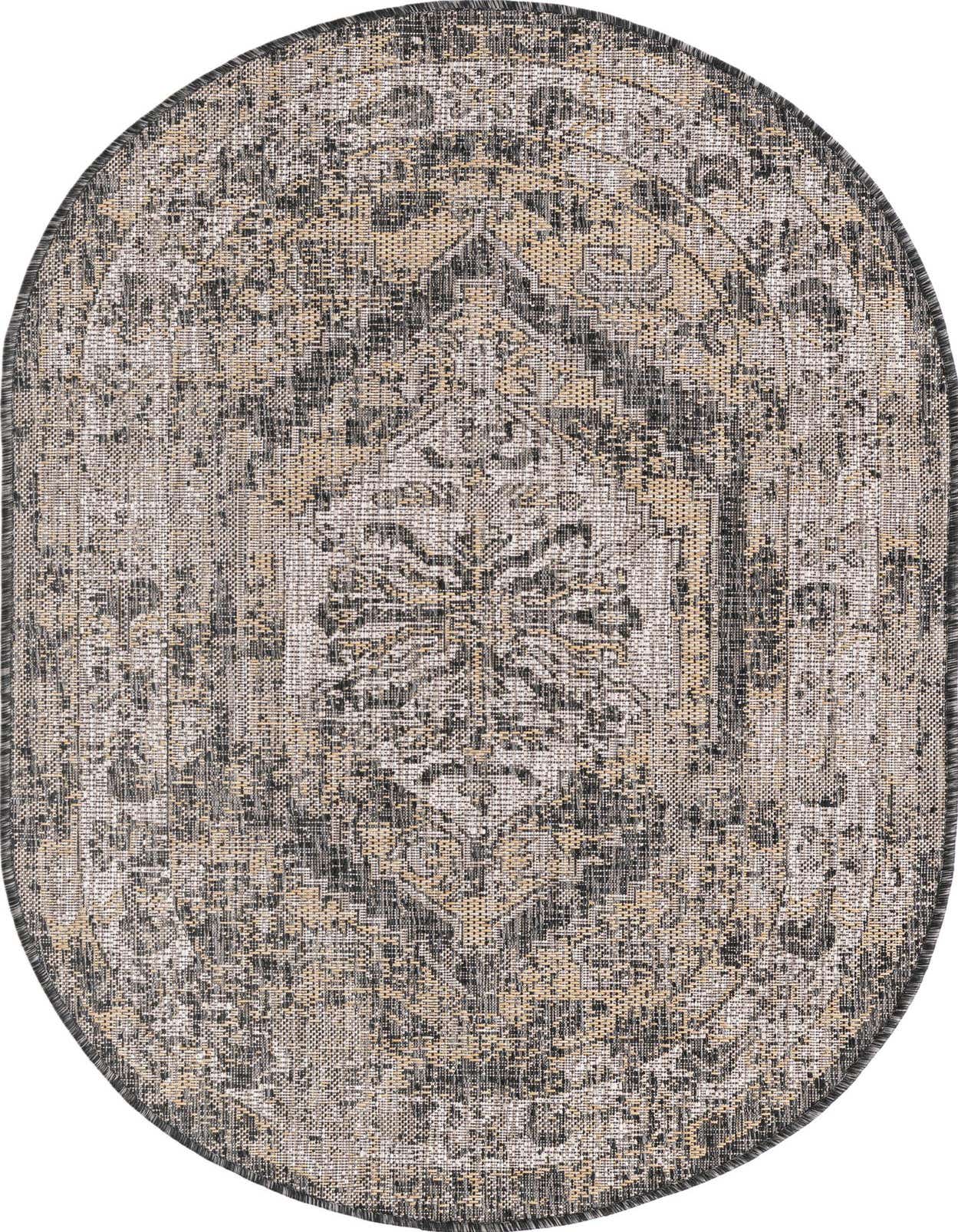 An oval 3' 0 x 5' 3 black and gray Southwestern style indoor/outdoor rug with a distressed traditional pattern.