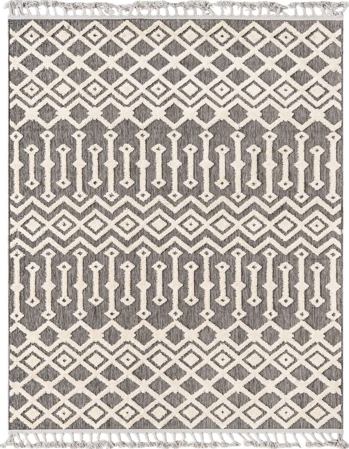 A 5x8 rectangular Arlo rug featuring a modern tribal pattern in black and off-white with textured high and low pile.