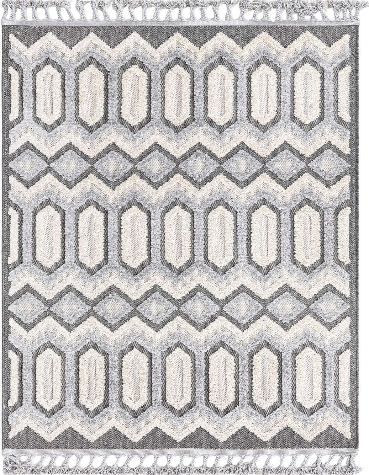 A 4x6 rectangular Arlo rug featuring a modern tribal pattern in black, gray, and off-white with tassels.