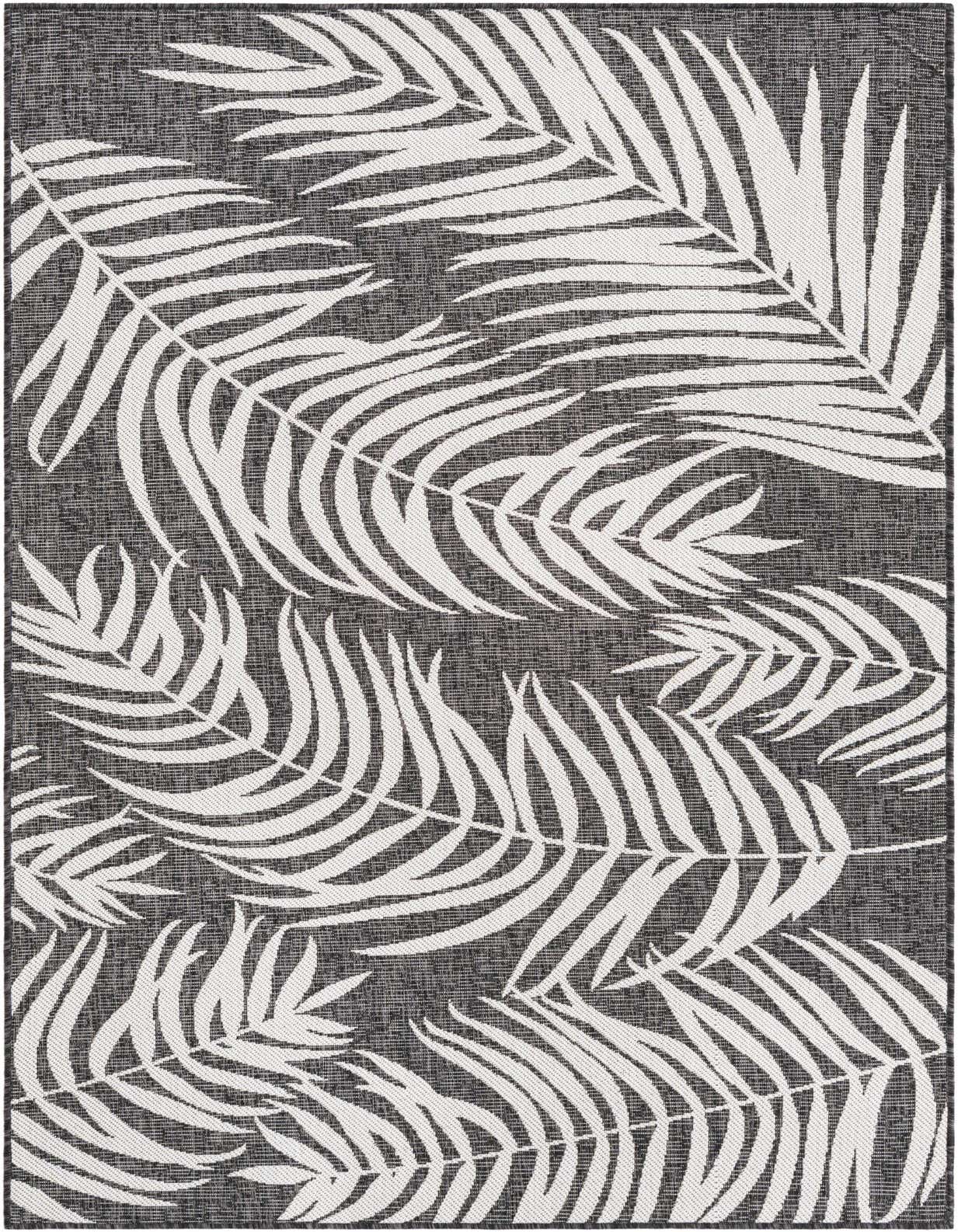 A 5x8 rectangular black and white flatweave rug with a bold tropical palm leaf pattern, suitable for indoor or outdoor use.