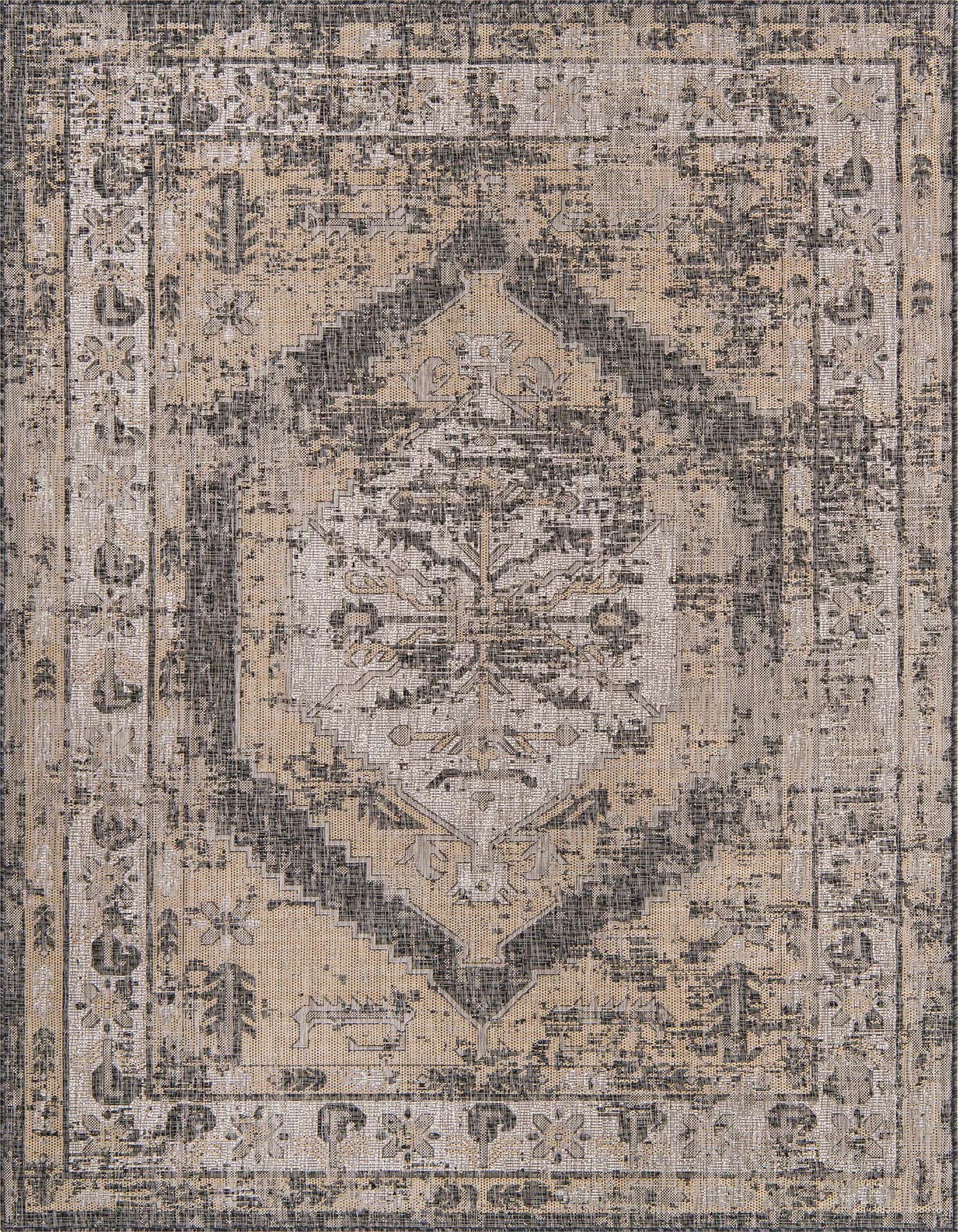 7x10 rectangular indoor/outdoor rug with a distressed black, gray, and beige Southwestern medallion pattern.