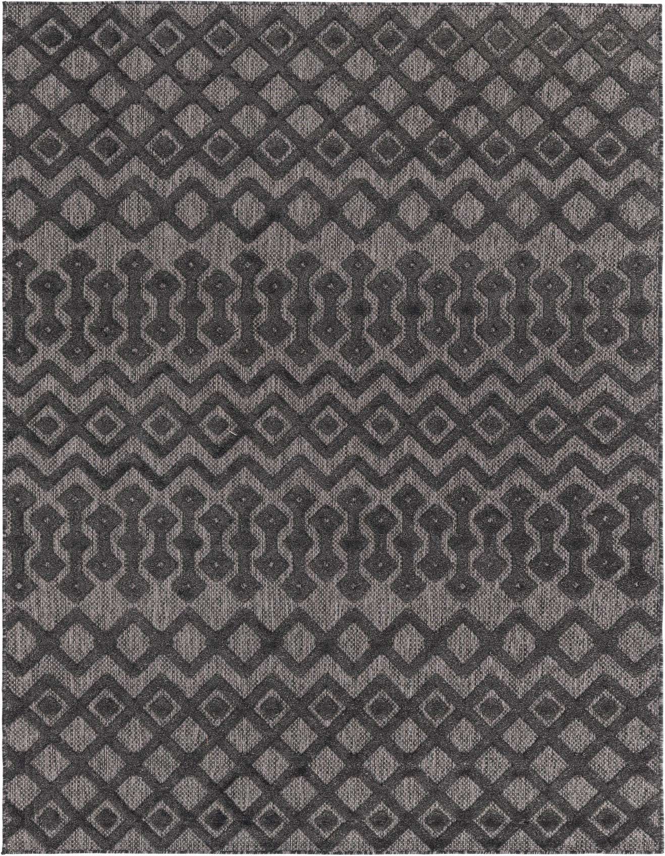 A 6x9 rectangular Rugs.com Outdoor Trellis Textured rug in black and gray with a tribal geometric pattern, suitable for indoor/outdoor use.