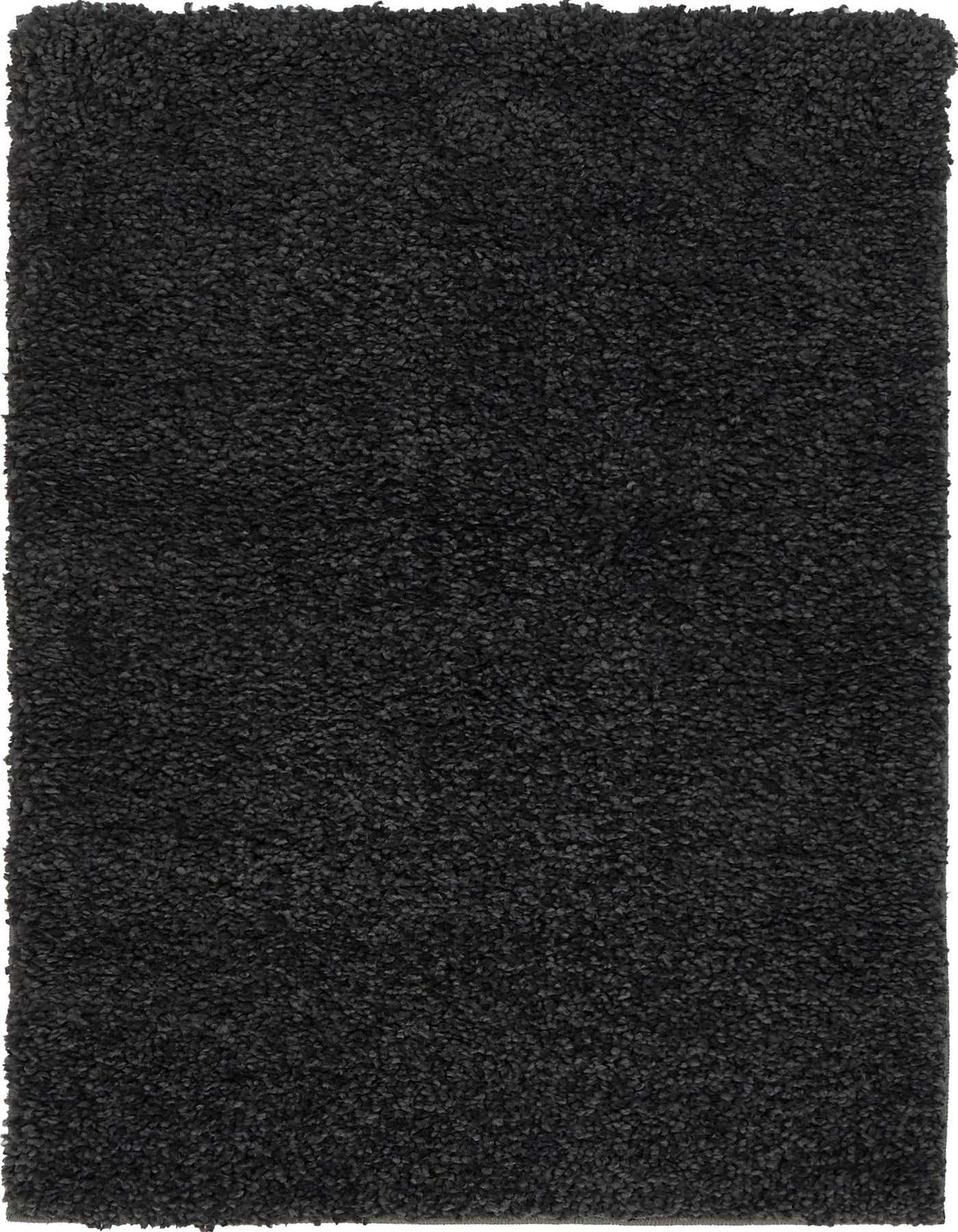 A rectangular 2x3 black shag rug with a textured, deep pile, perfect for adding comfort to any indoor space.