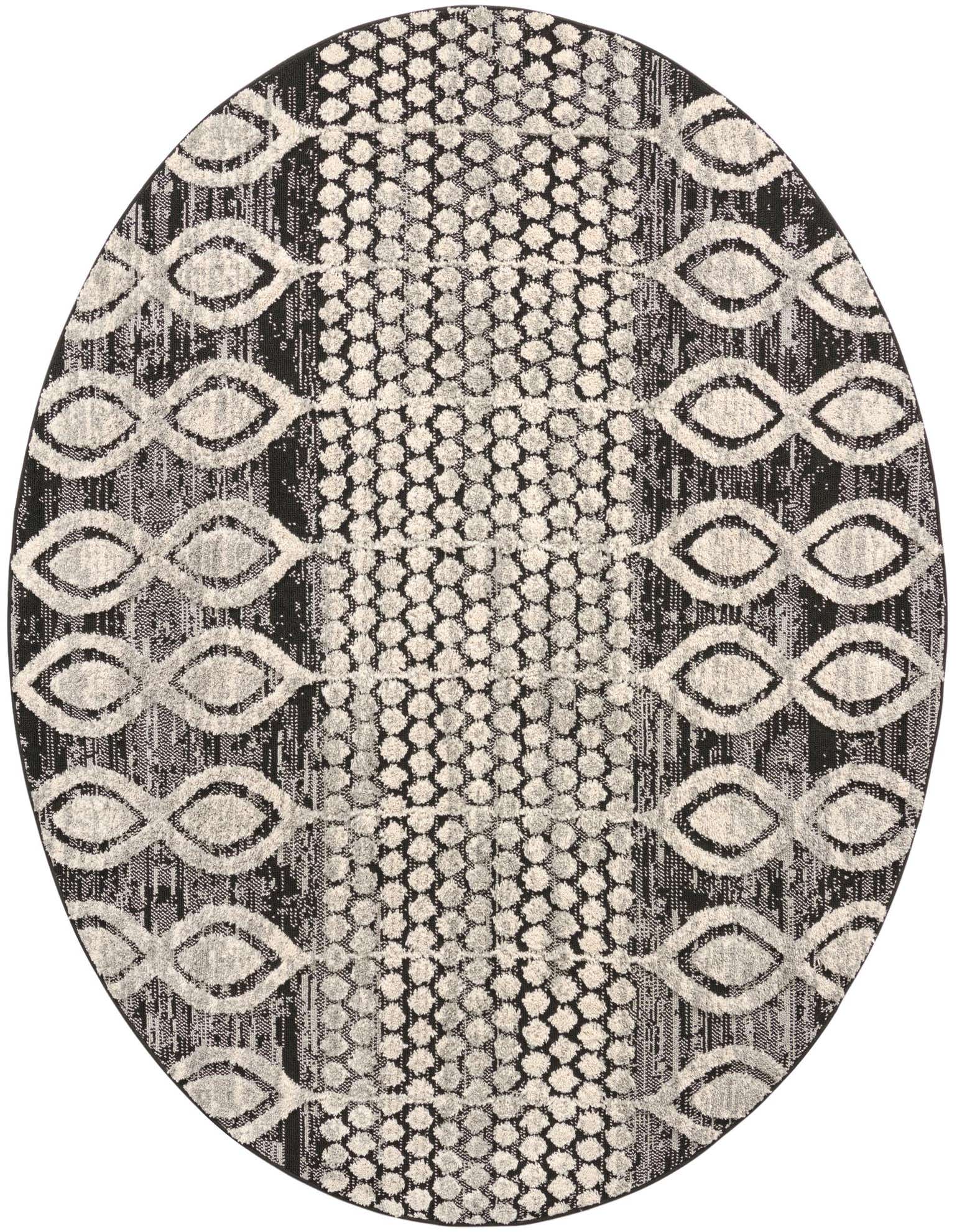 A round 7' black and gray tribal rug featuring a central dotted pattern flanked by abstract eye-shaped motifs.