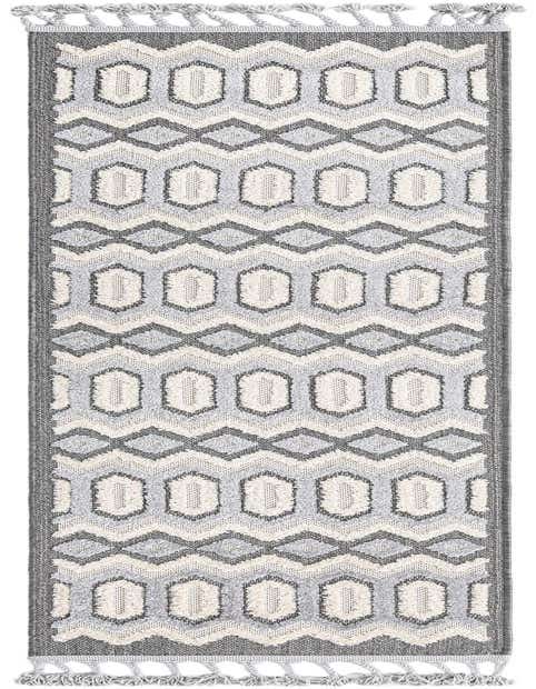 A black, gray, and white tribal runner rug with geometric patterns and braided tassels, ideal for a hallway.