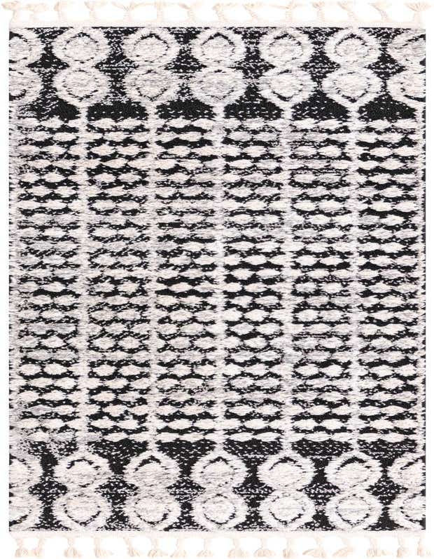 A 6 ft runner rug with a black background and a textured tribal pattern in white and gray, featuring decorative tassels.