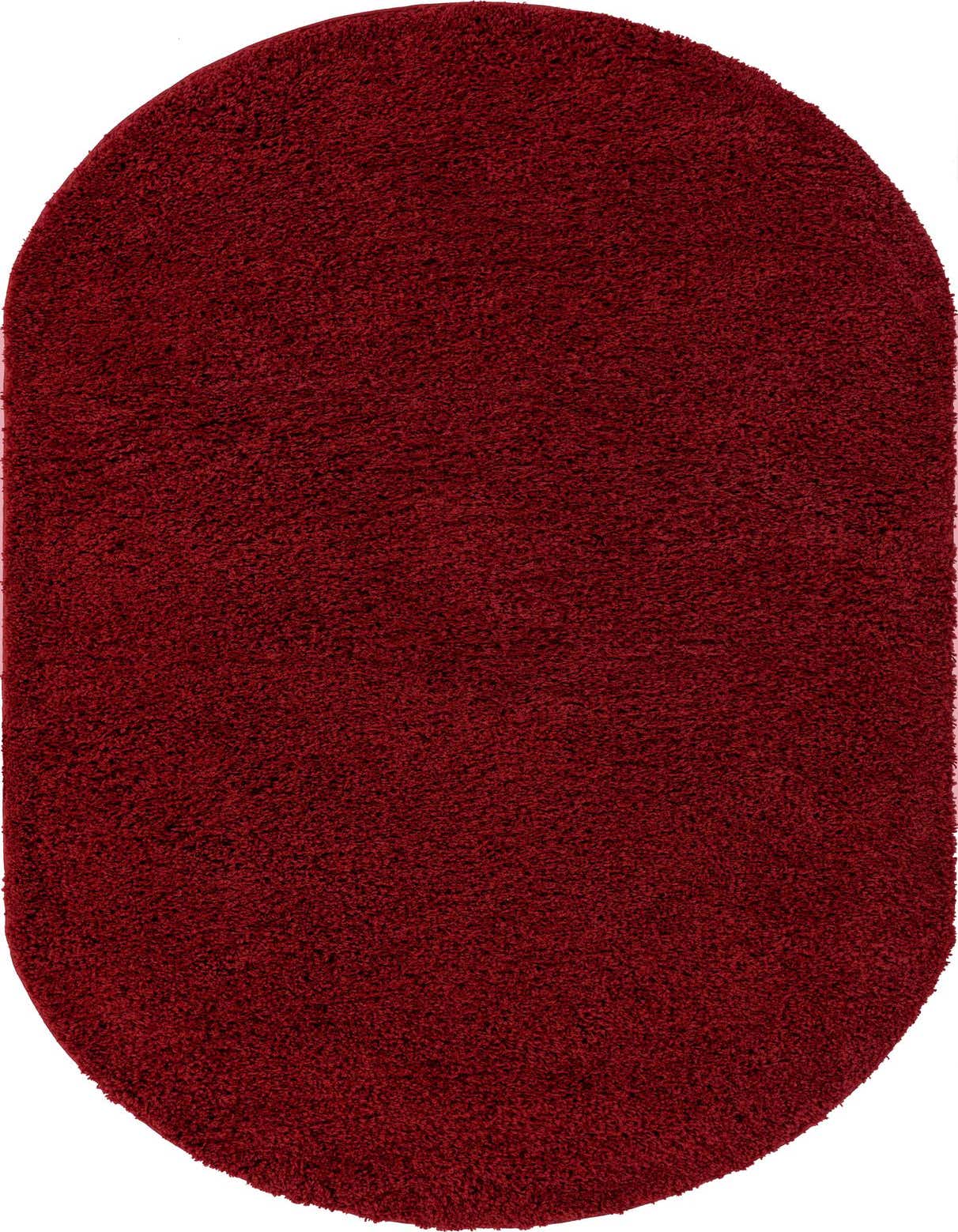A 5' x 8' oval red shag rug, made from polypropylene, showcasing its soft, textured pile.