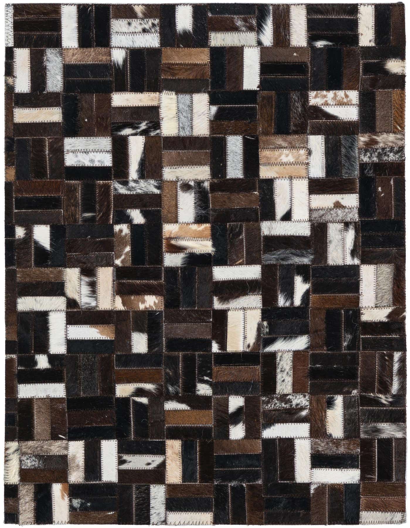 A 2x3 rectangular Cowhide & Leather rug featuring a modern patchwork of brown, tan, black, and white hide squares, suitable for a kitchen or entryway.