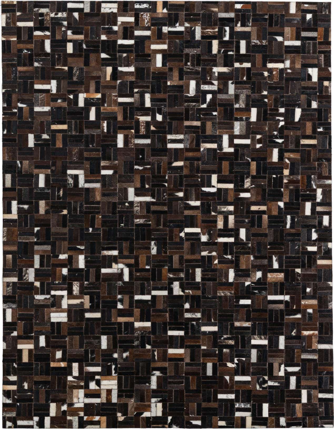 A rectangular 5x8 brown and tan cowhide and leather rug with a modern striped patchwork pattern.