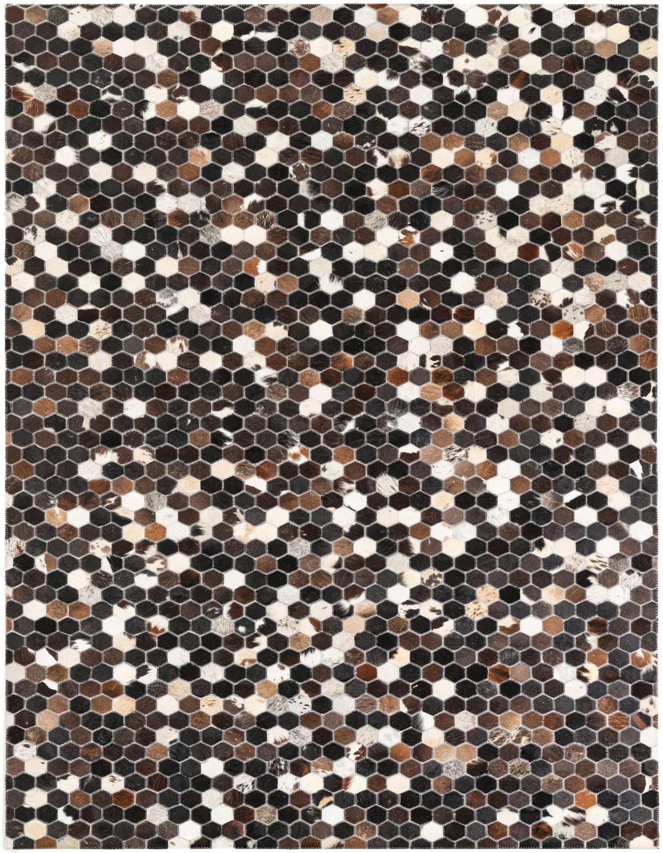 A 5x8 rectangular rug with a modern, abstract pattern of small hexagonal patches in varying shades of brown, tan, black, and white cowhide.