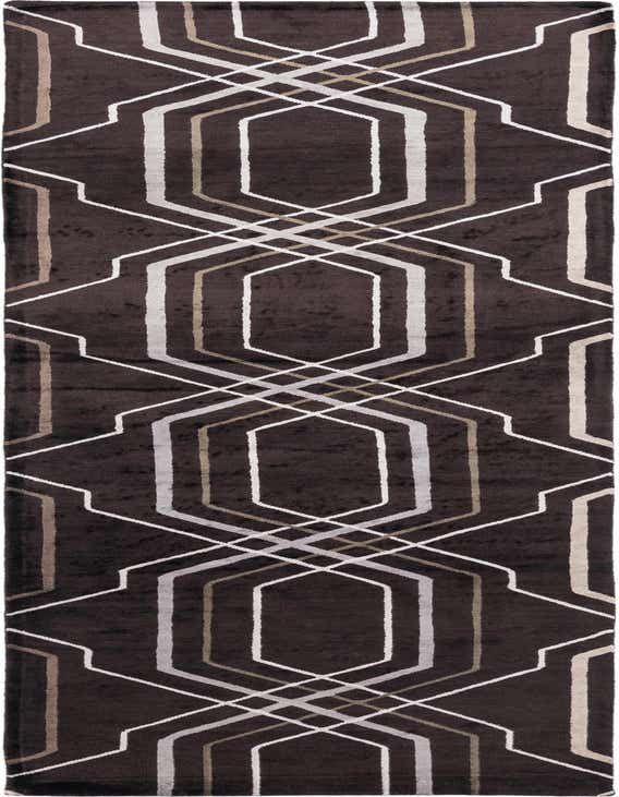 A 10 ft Darya runner rug in dark brown with a modern geometric pattern of interlocking white, silver, and tan lines.