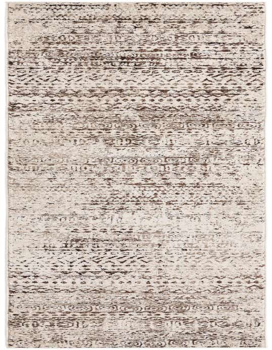 A 10 ft runner rug featuring a modern tribal stripe pattern in varying shades of brown and tan, with a textured high/low pile.