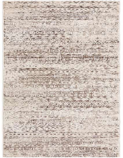 A 13 ft runner rug in shades of brown and tan, featuring a modern tribal stripe pattern with a textured high/low pile.